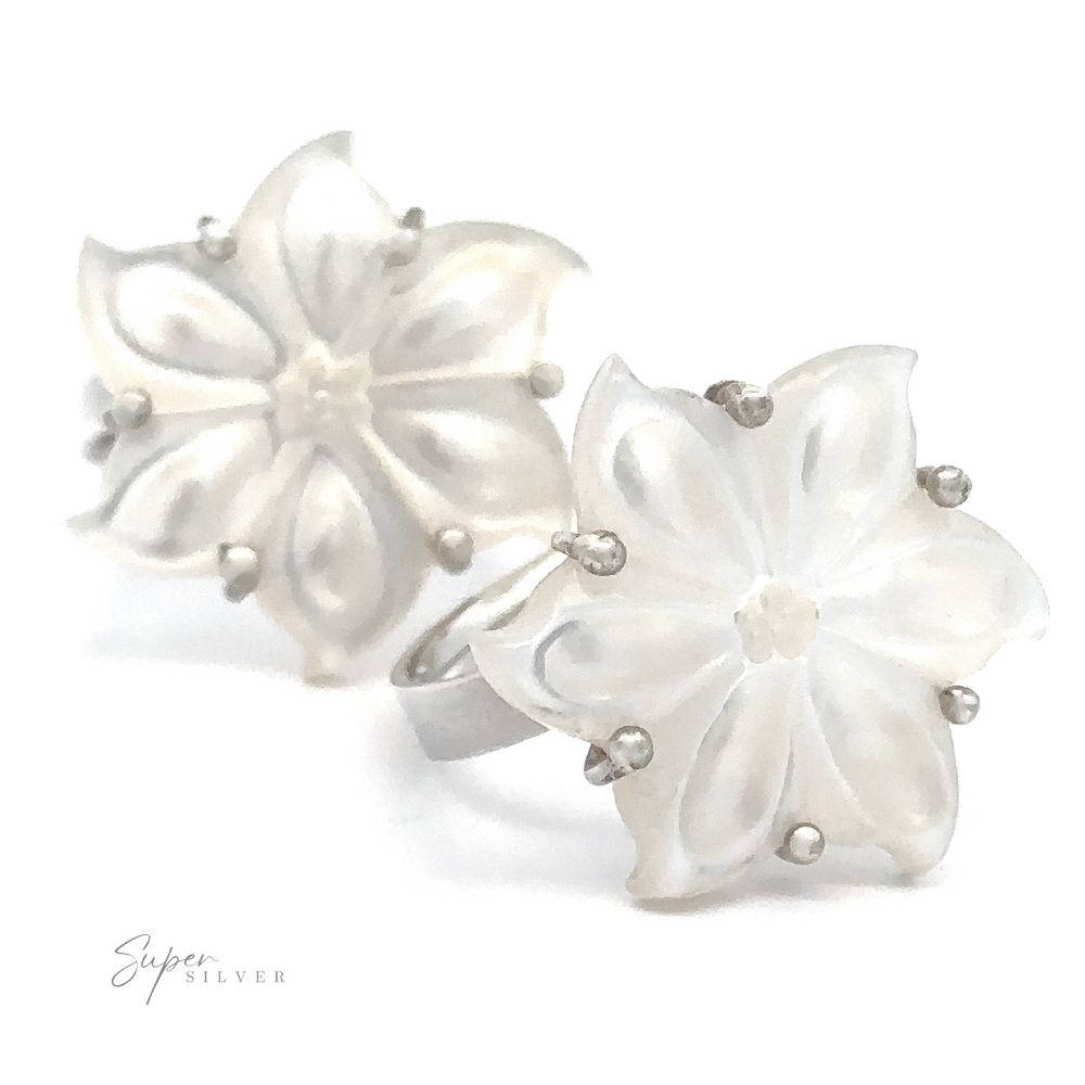 Pair of adjustable mother-of-pearl flower-shaped earrings with translucent petals and sterling silver detailing.