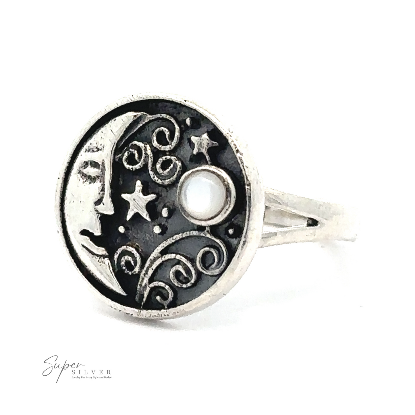 
                  
                    A Circular Vintage Style Moon Ring With Inlaid Stone in sterling silver, featuring a celestial design with the face of the moon, stars, and swirls, accented by a small circular pearl-like detail.
                  
                