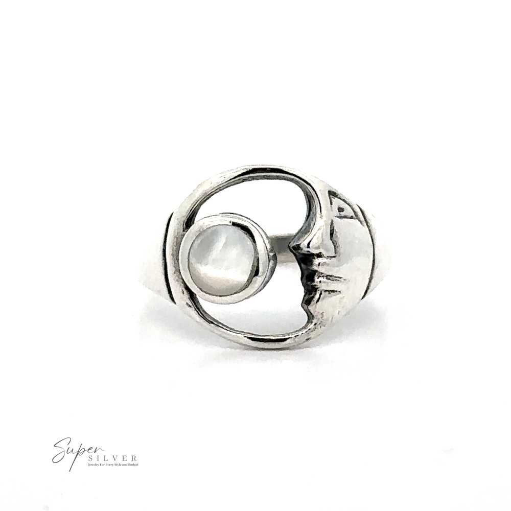 
                  
                    A sterling silver Crescent Moon Ring With Inlaid Stone featuring a circular design with a face in profile paired with a round, pearl-like stone. This celestial charm is from Super Silver.
                  
                