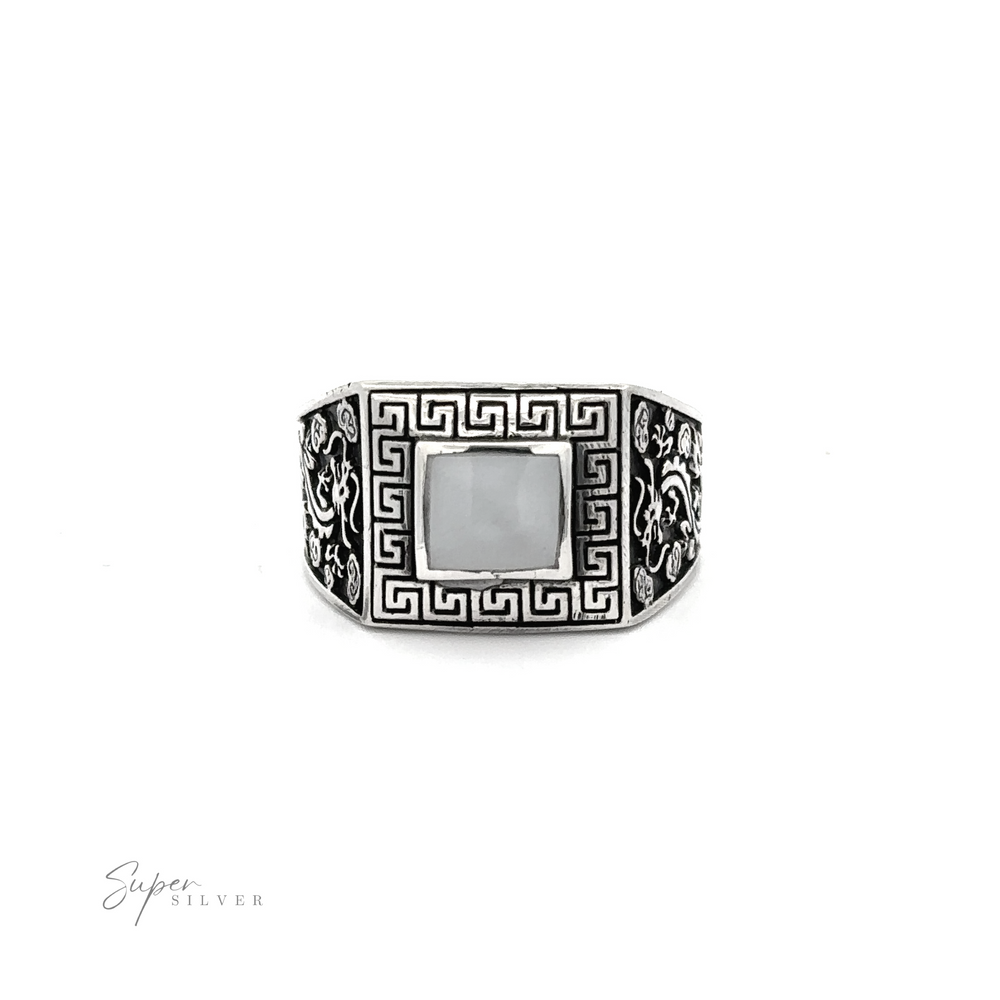 
                  
                    This stone signet ring with dragon design showcases an ornate Greek swirl design.
                  
                