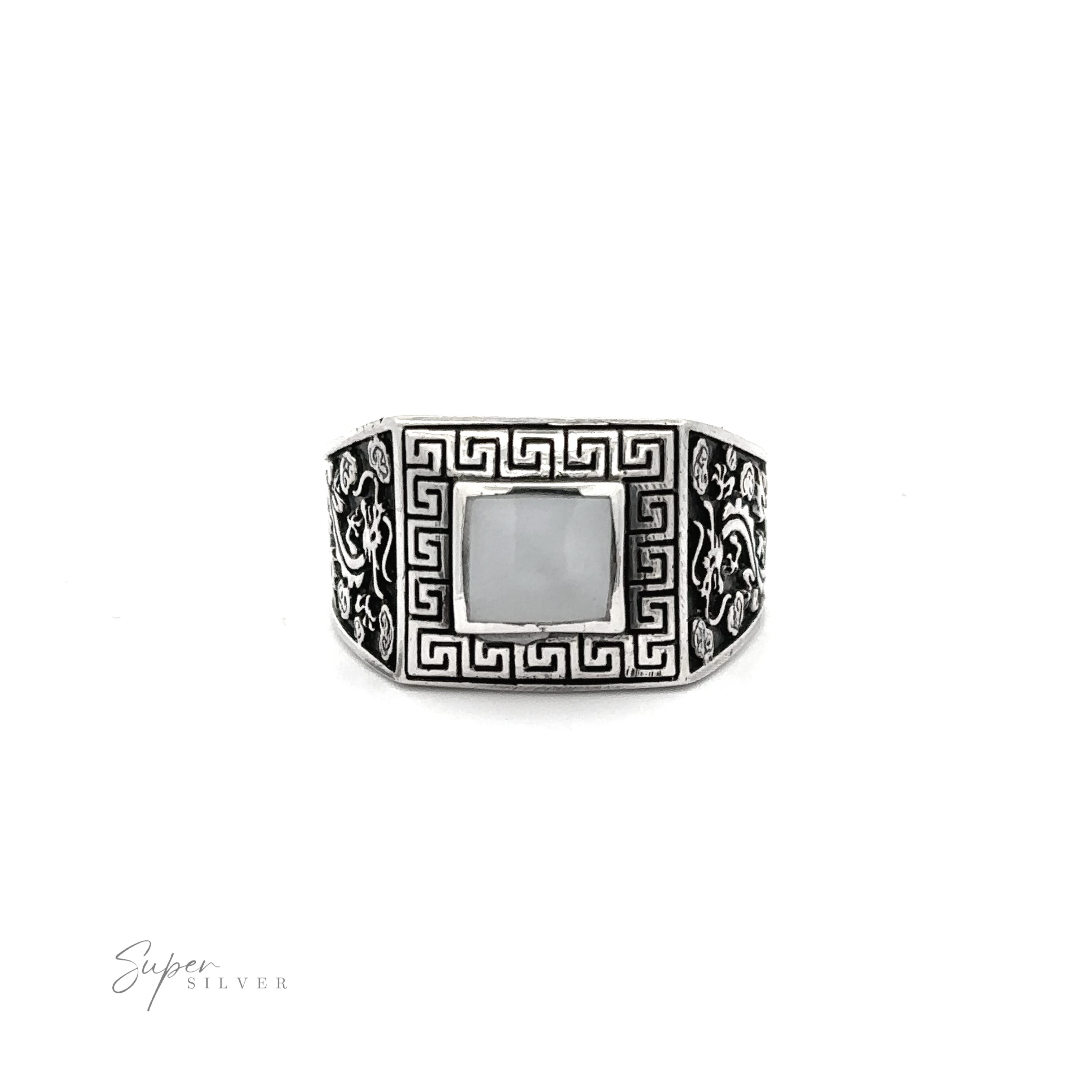 This stone signet ring with dragon design showcases an ornate Greek swirl design.