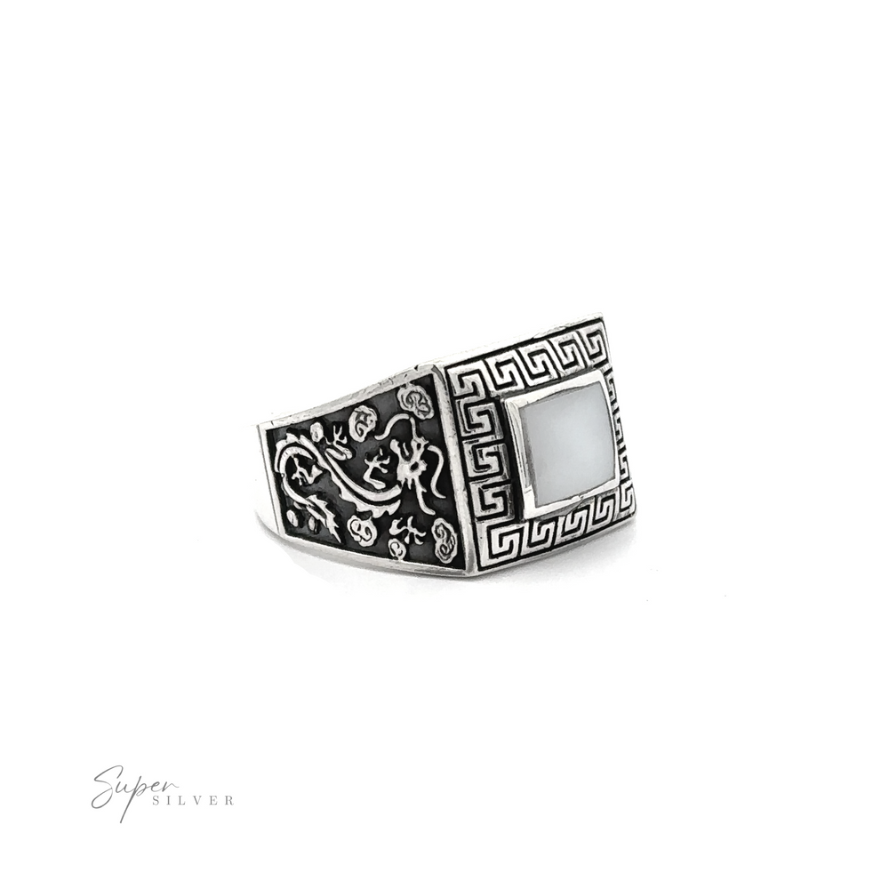 
                  
                    A Stone Signet Ring with Dragon Design with an ornate Greek swirl design.
                  
                
