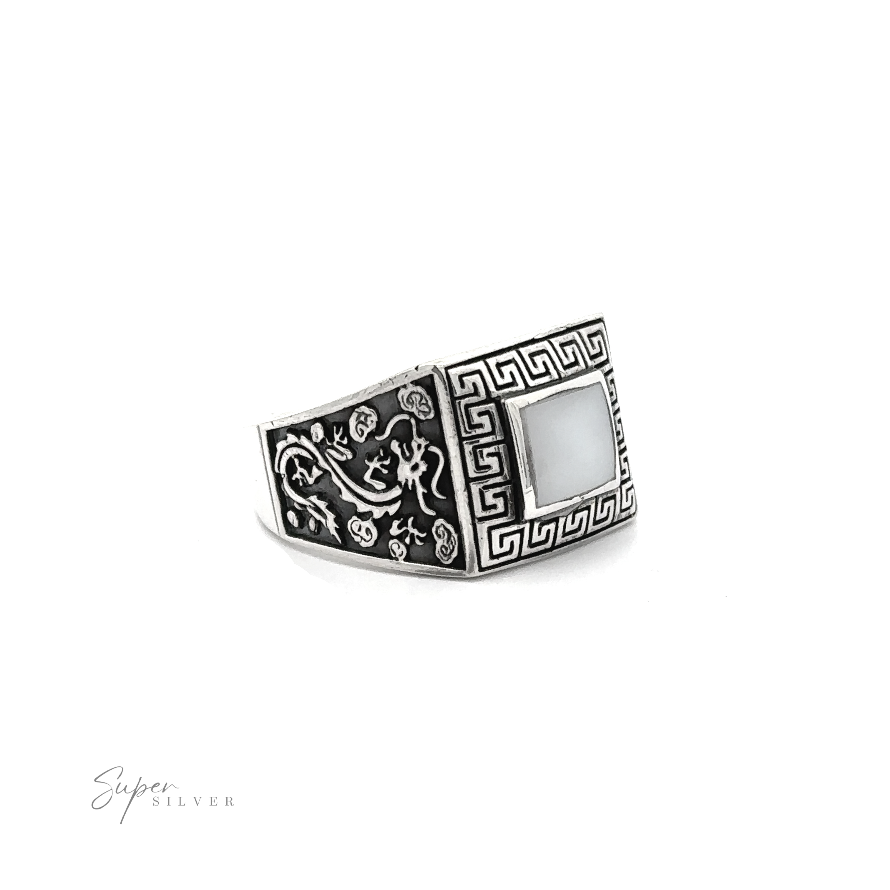 A Stone Signet Ring with Dragon Design with an ornate Greek swirl design.
