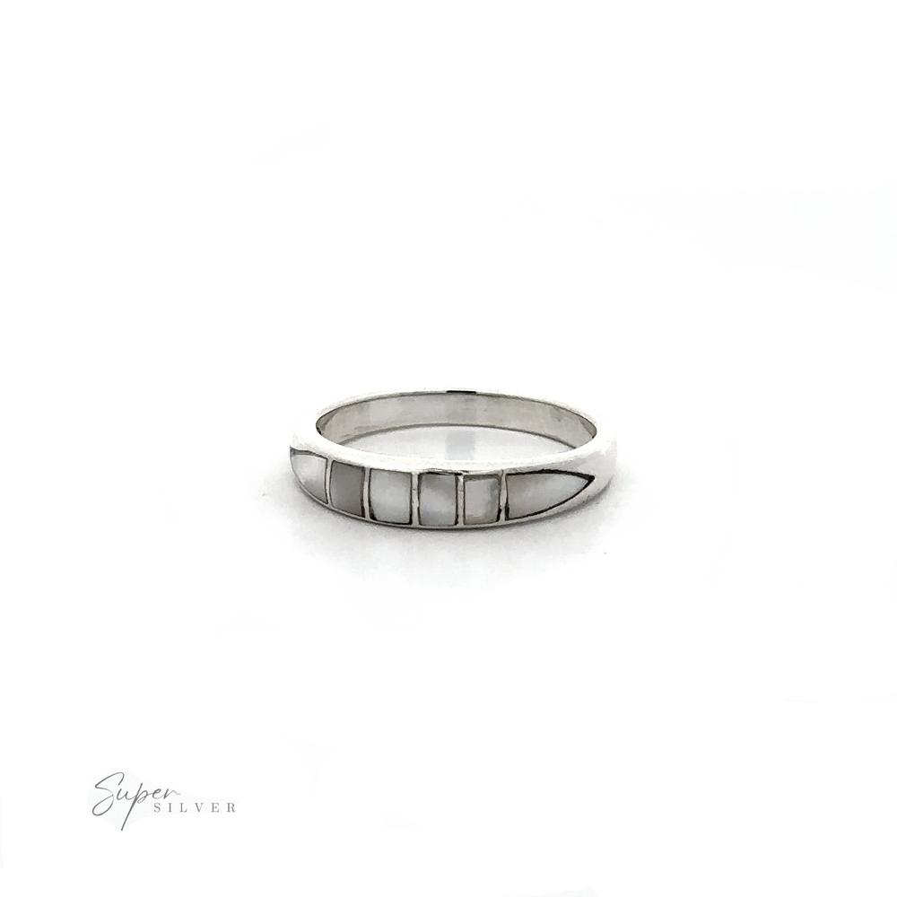 
                  
                    A white gold Inlay Stone Band with a dome design and inlaid white mother of pearl, perfect for stacking.
                  
                