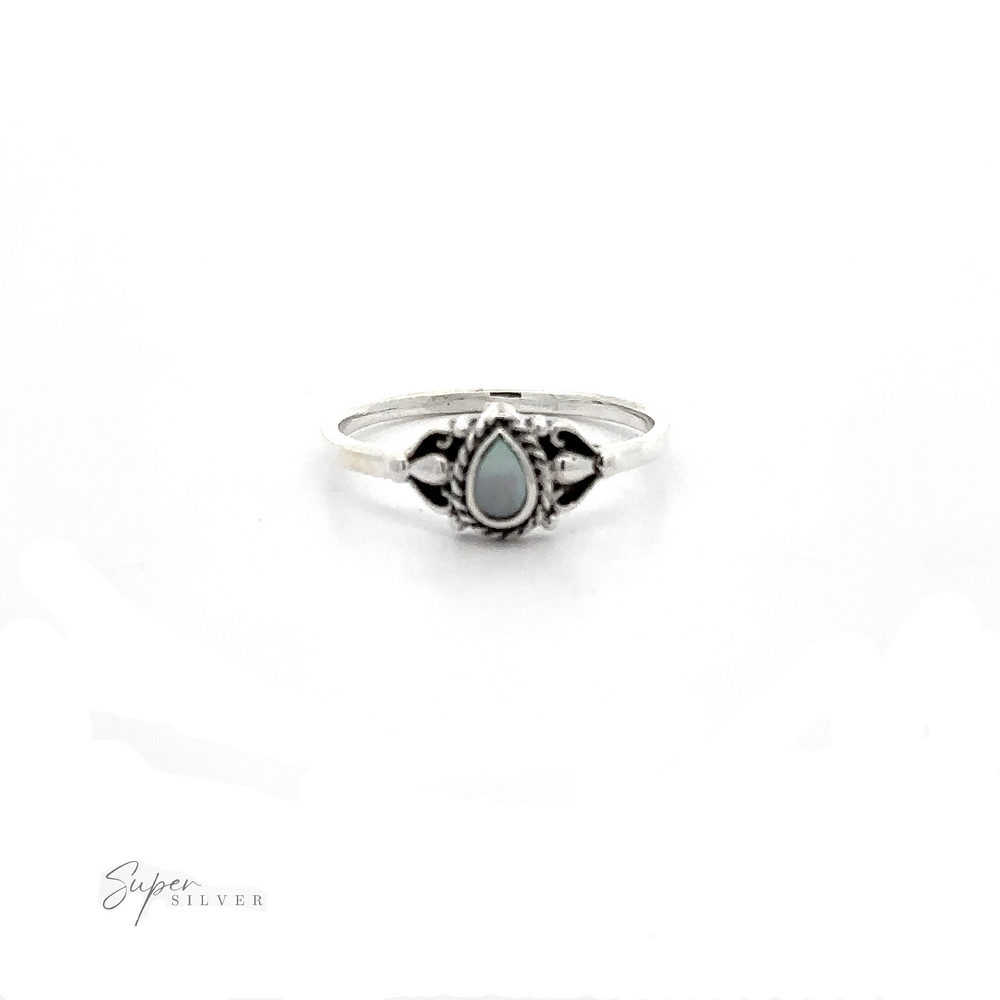 
                  
                    A Delicate Teardrop Inlay Stone Ring with Vintage Look with an inlaid turquoise stone.
                  
                