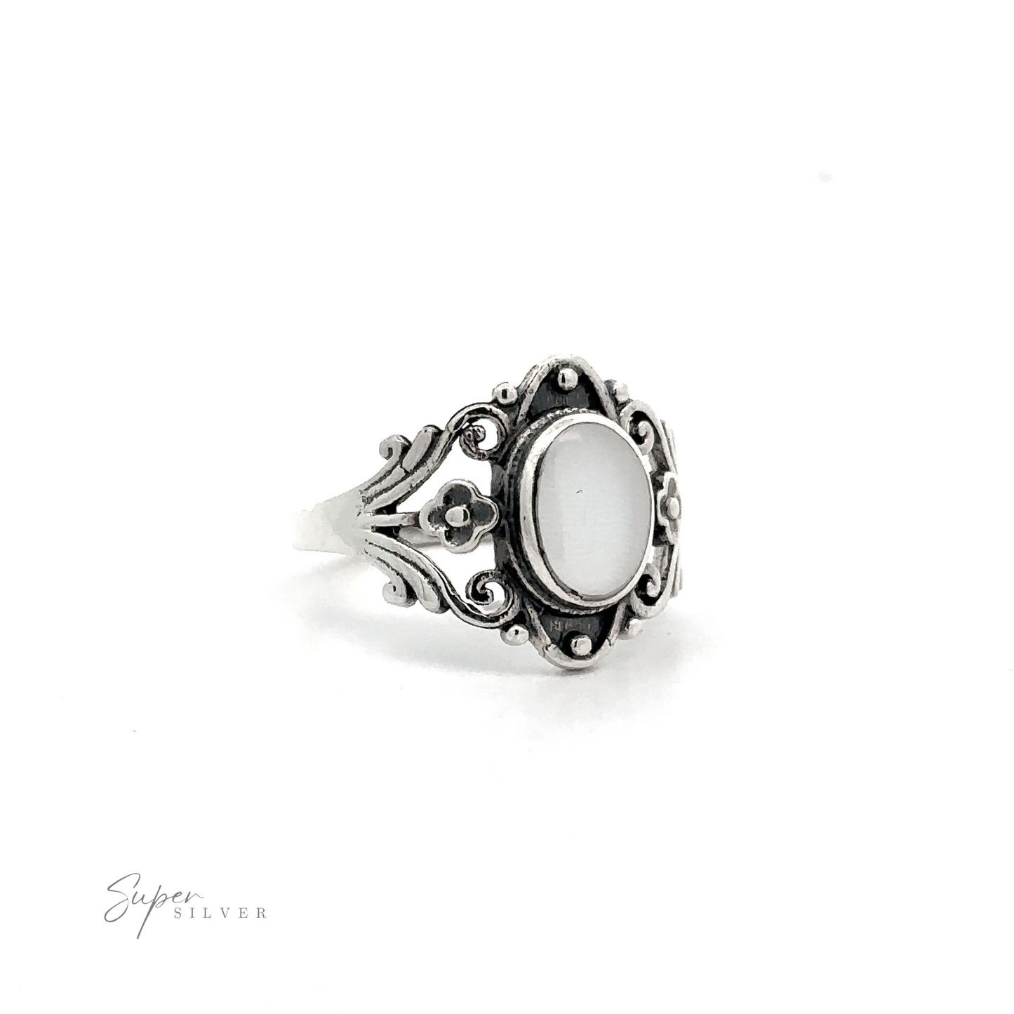 
                  
                    Floral Filigree Inlay Stone Ring with a white stone.
                  
                