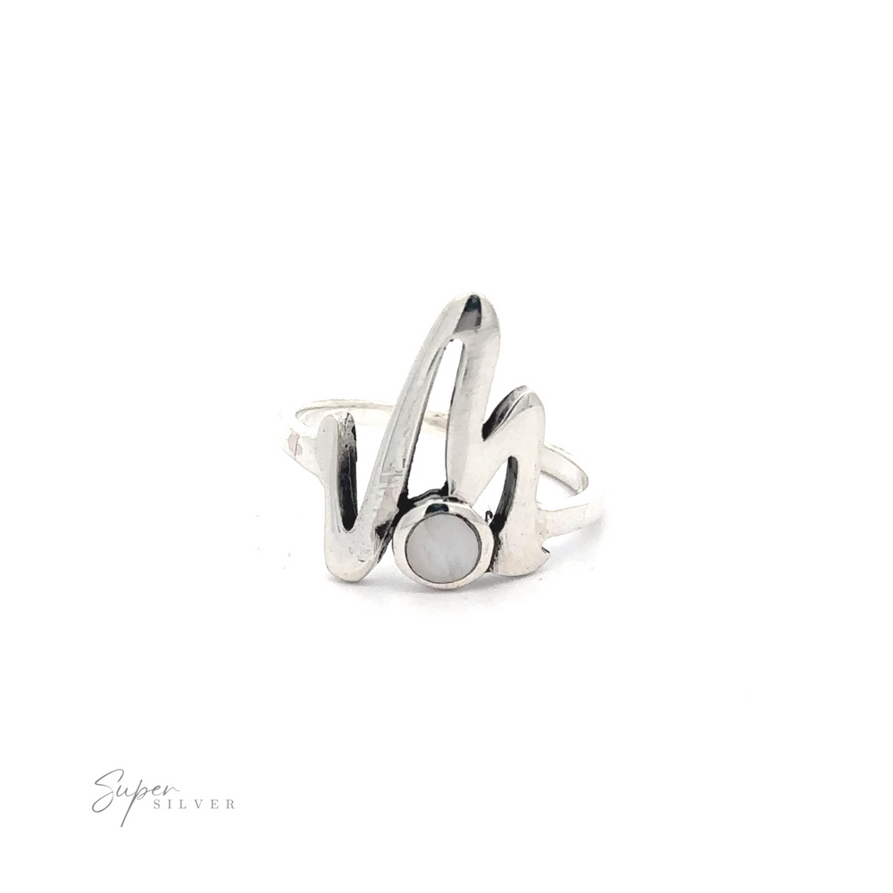
                  
                    Stone Inlay Zig Zag ring with an abstract, flowing design and a central onyx stone, isolated on a white background with a signature in the corner.
                  
                