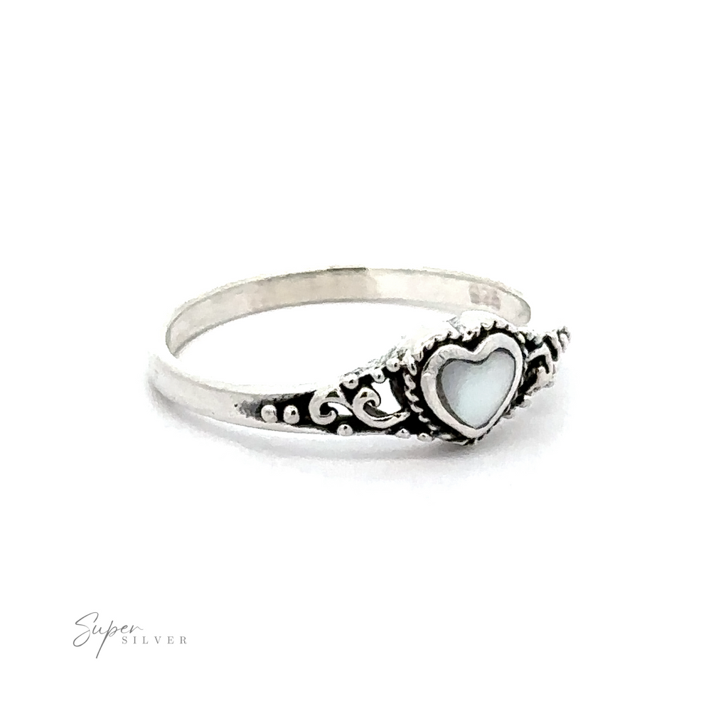 
                  
                    A Dainty Heart Filigree Ring with Inlaid Stones with a Bali-style filigree design and white mother-of-pearl.
                  
                