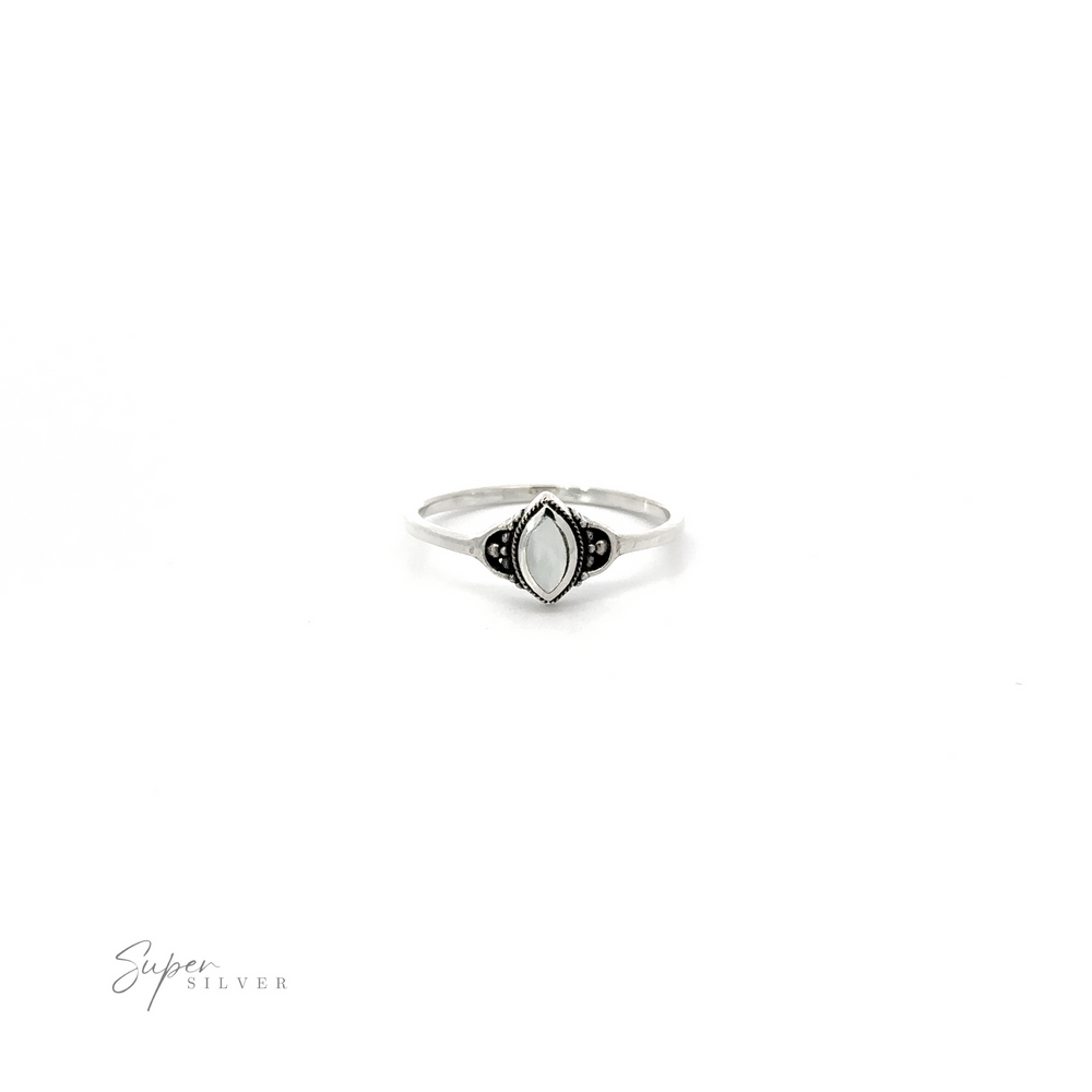 
                  
                    A Delicate Marquise Inlaid Stone Ring in sterling silver with black and white stones.
                  
                