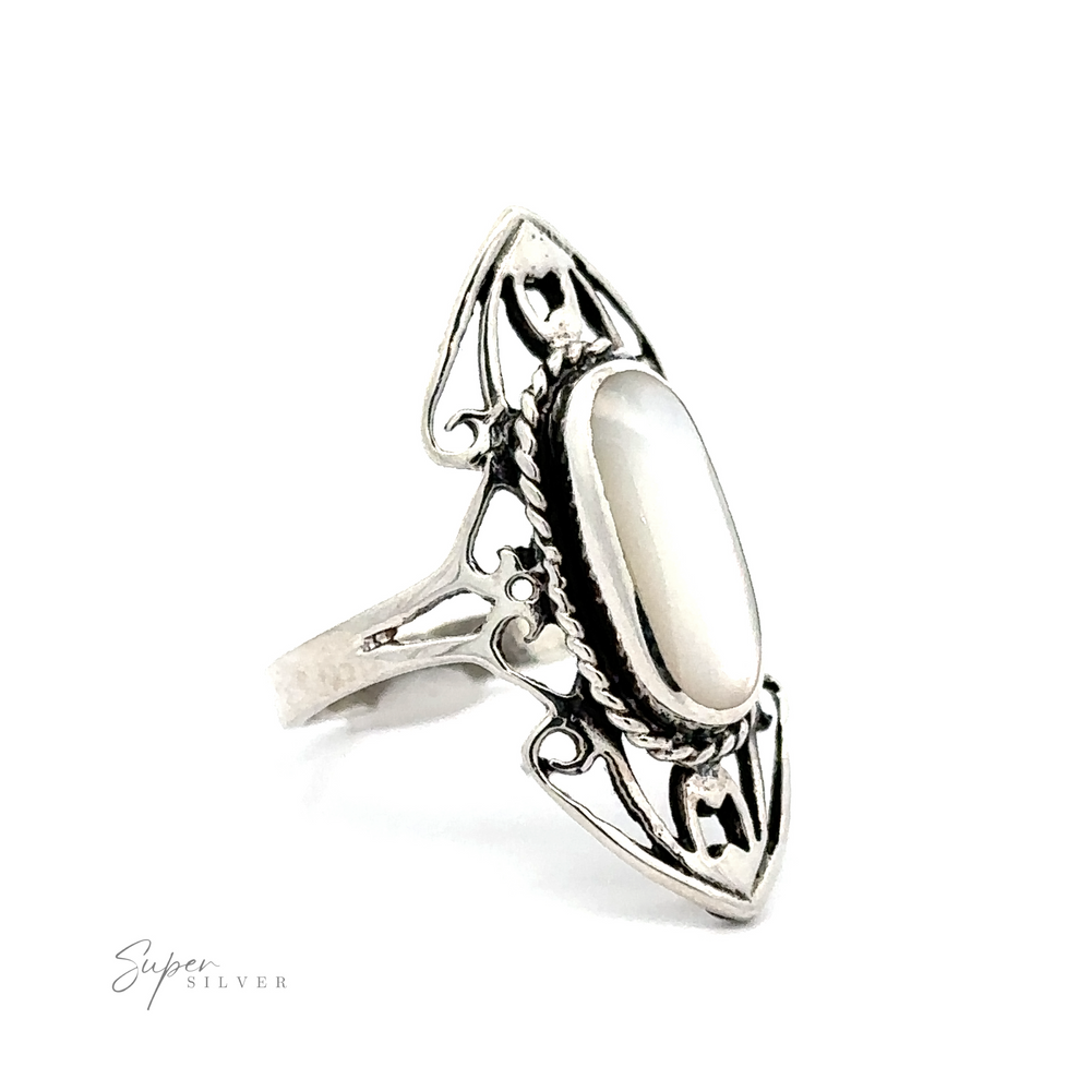 
                  
                    A sterling silver elongated filigree ring with an oval inlaid stone set in the ornate open band.
                  
                