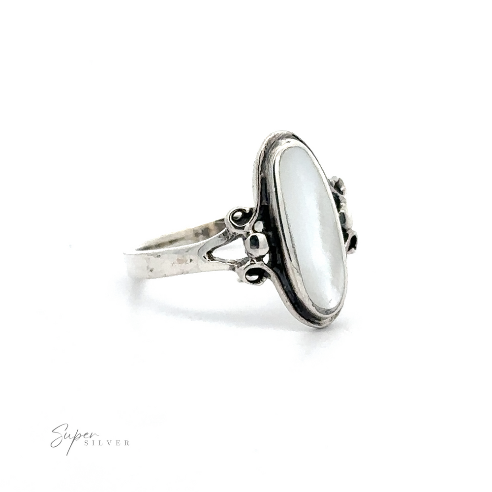 
                  
                    Sterling silver ring with a large Oval Stone Ring with Delicate Border and ornate band, displayed against a white background.
                  
                
