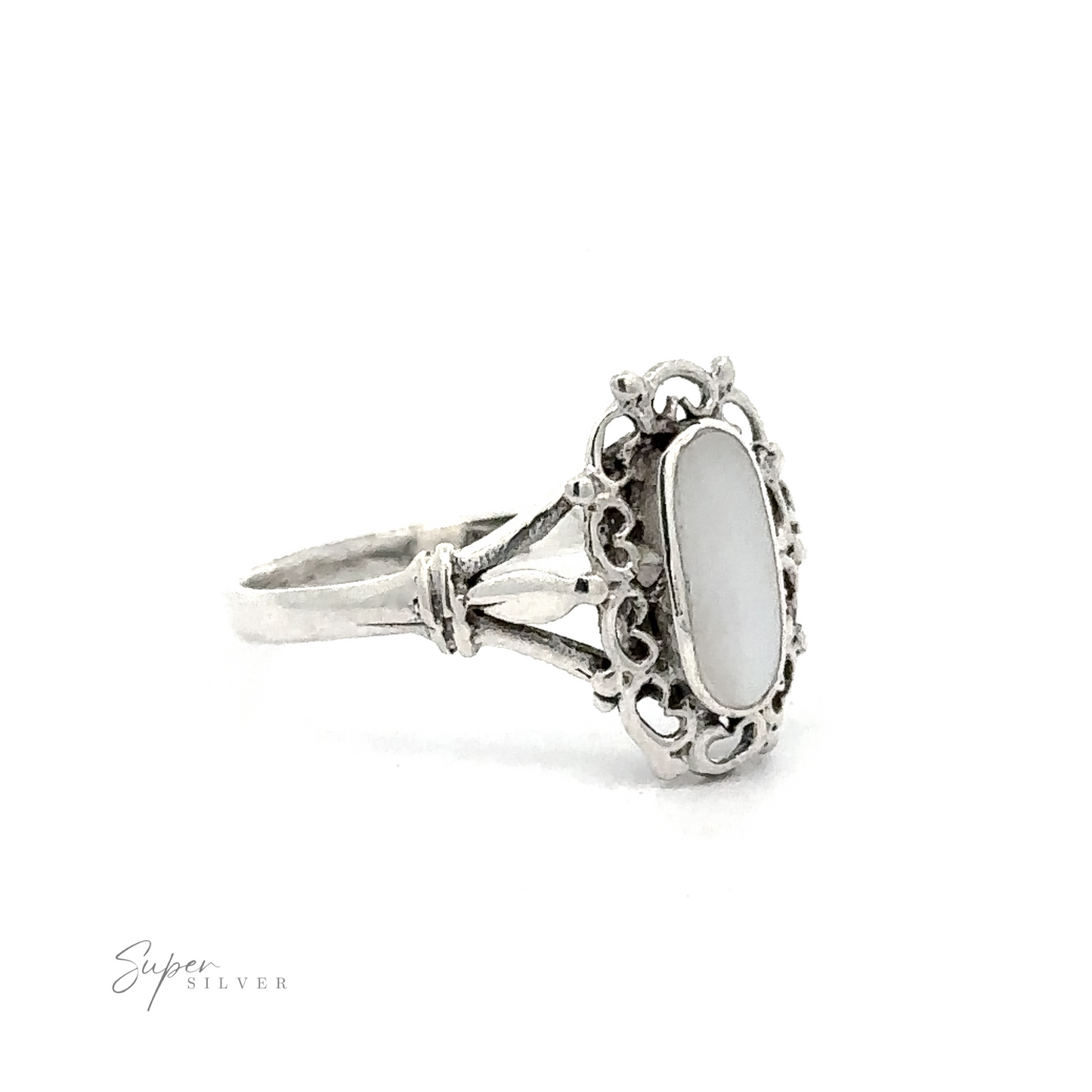 
                  
                    A Inlaid Oval Ring with Filigree Heart Border on a white background.
                  
                