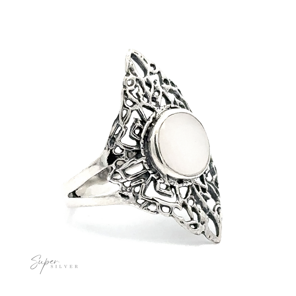 
                  
                    A Diamond Shaped Filigree Ring With A Round Inlaid Stone
                  
                