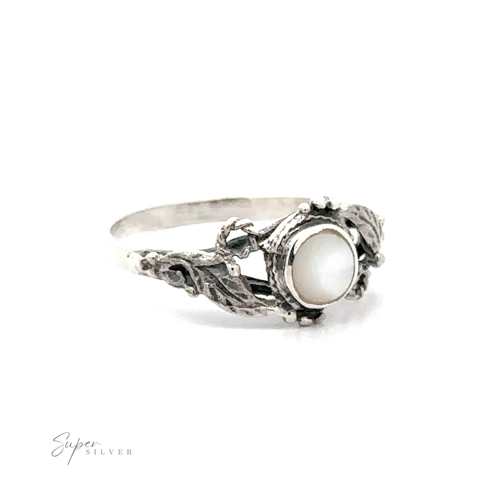 
                  
                    Rope and Leaves Inlay Stone ring with a white stone and elegant, ornate band displayed on a white background.
                  
                