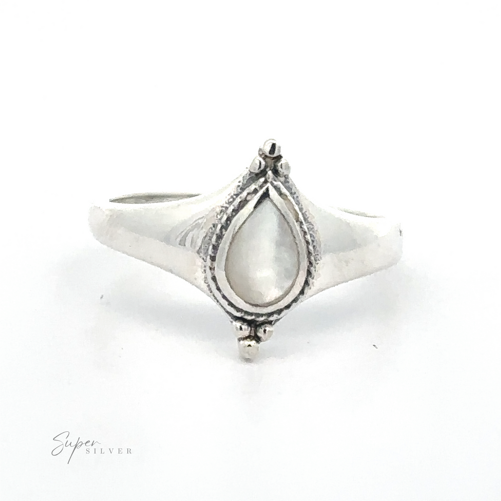 
                  
                    Teardrop Inlay Shield Ring with a pear-shaped gemstone set in an ornate bezel.
                  
                