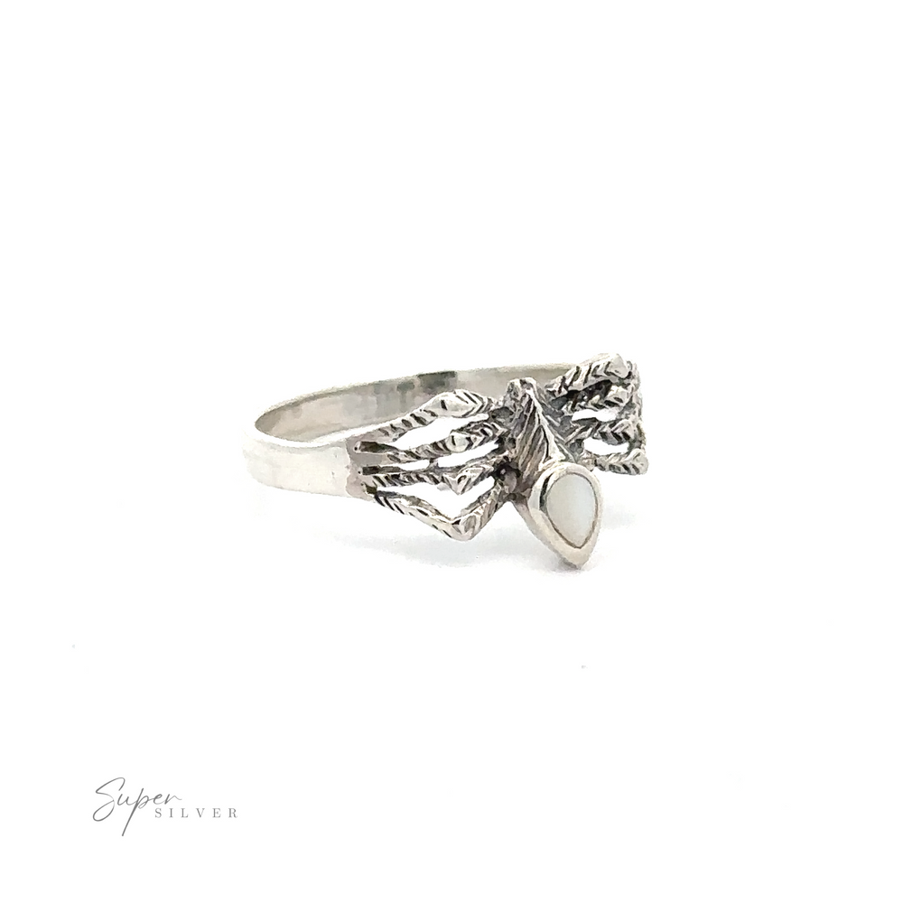 
                  
                    A Small Inlay Spider Ring featuring an intricate leaf design with a small, white oval centerpiece gemstone, exuding the charm of mystical jewelry.
                  
                