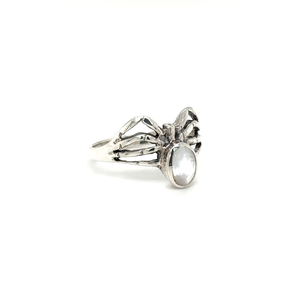 
                  
                    A mystical Super Silver ring with enchanting wings and a captivating Inlay Stone Spider.
                  
                