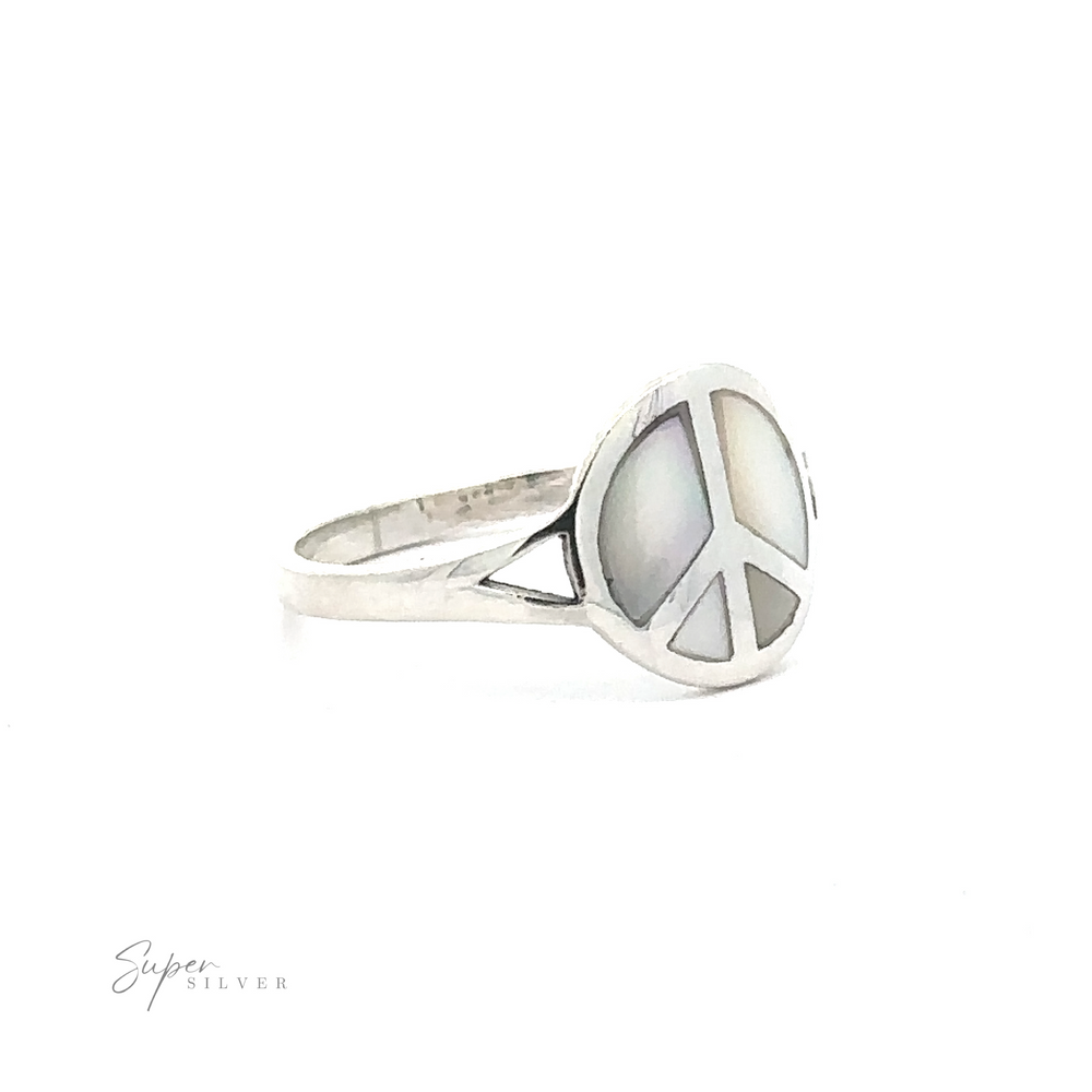 
                  
                    A stunning Stone Inlay Peace Sign Ring, featuring a silver band with an intricate design and a mother-of-pearl inlay. The face of the ring proudly displays the peace sign, enhanced by the text "Super Silver" in the bottom left corner. This elegant piece also incorporates accents of onyx for added sophistication.
                  
                