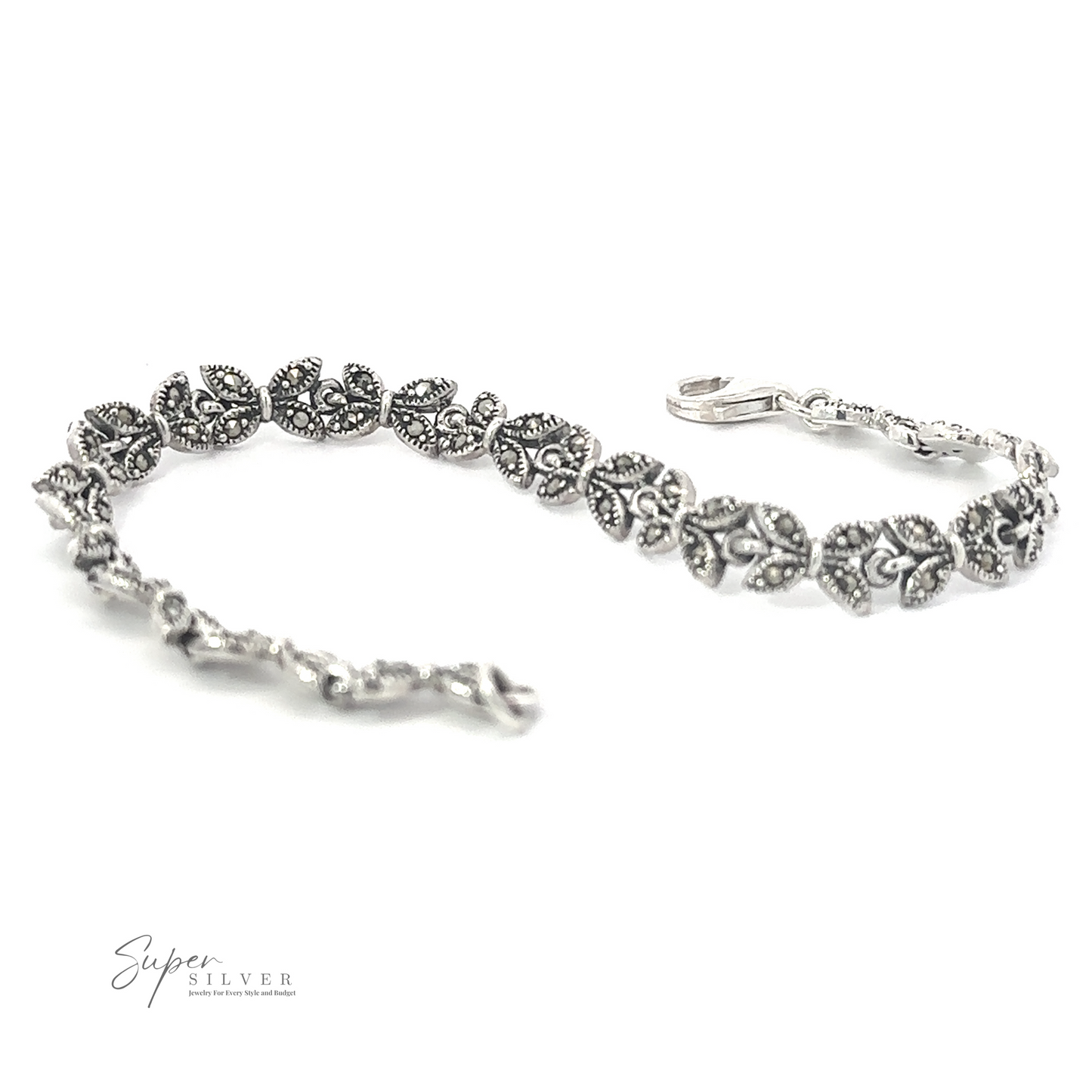 
                  
                    A Marcasite Butterfly Bracelet with detailed floral and leaf designs, placed on a white background. Made of .925 Sterling Silver, it features a subtle Art Deco era style. The clasp is visible, and the text "Super Silver" is in the bottom left corner.
                  
                