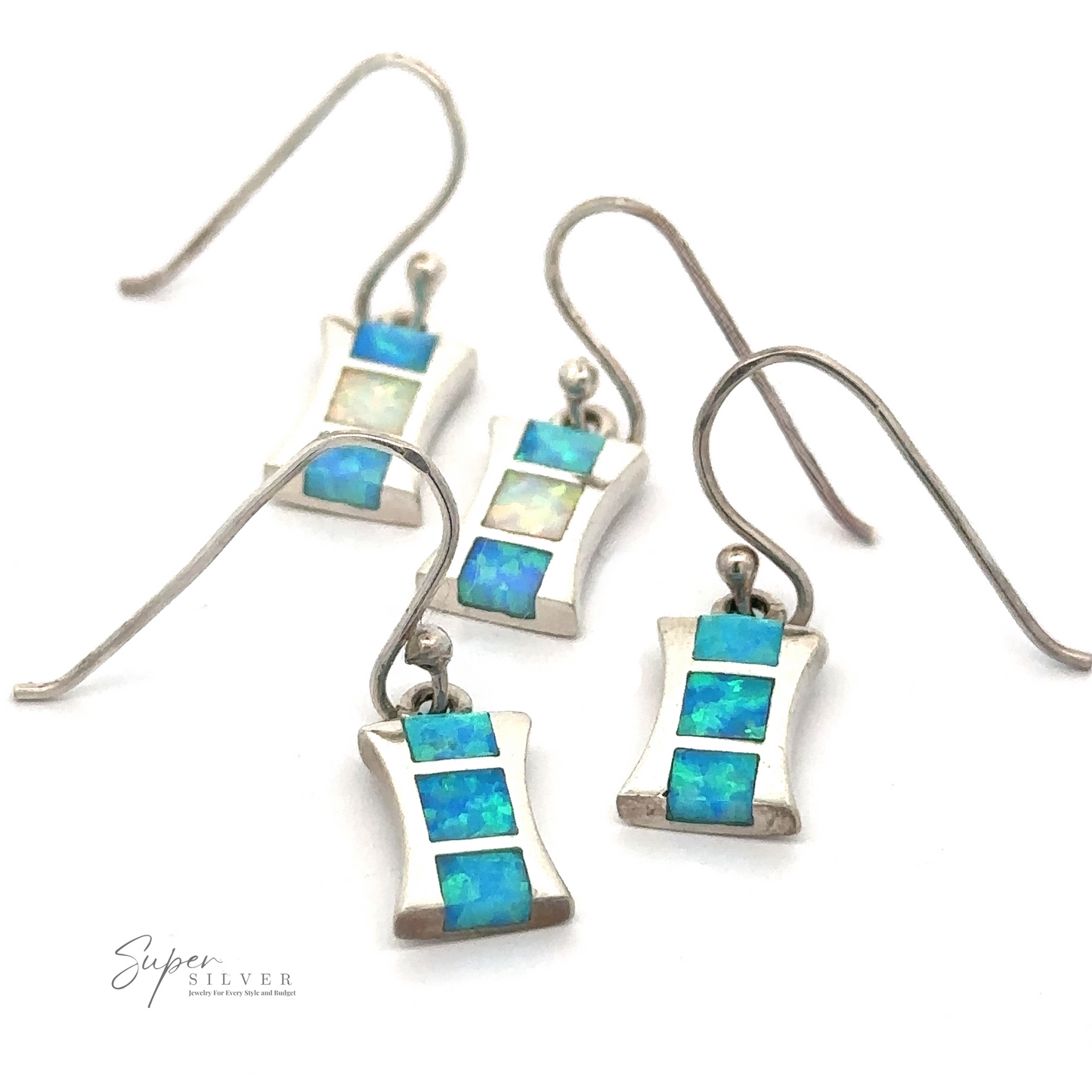 Four Freeform Lab-Created Opal Earrings are arranged in a scattered fashion on a white background. The logo "Super Silver" is visible in the bottom left corner.