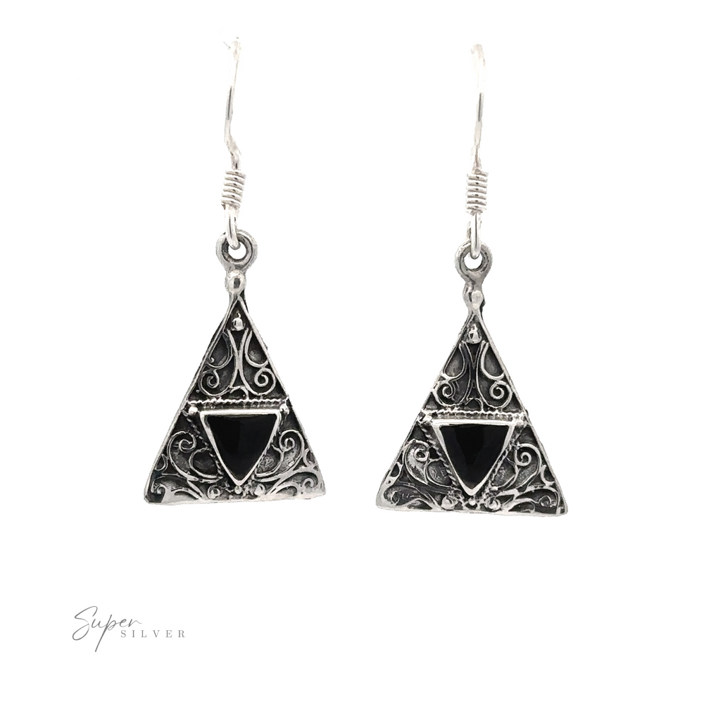 
                  
                    Freestyle Design Triangle Shape Inlaid Earrings featuring intricate scrollwork and triangle-shaped silver settings with black triangular stones.
                  
                