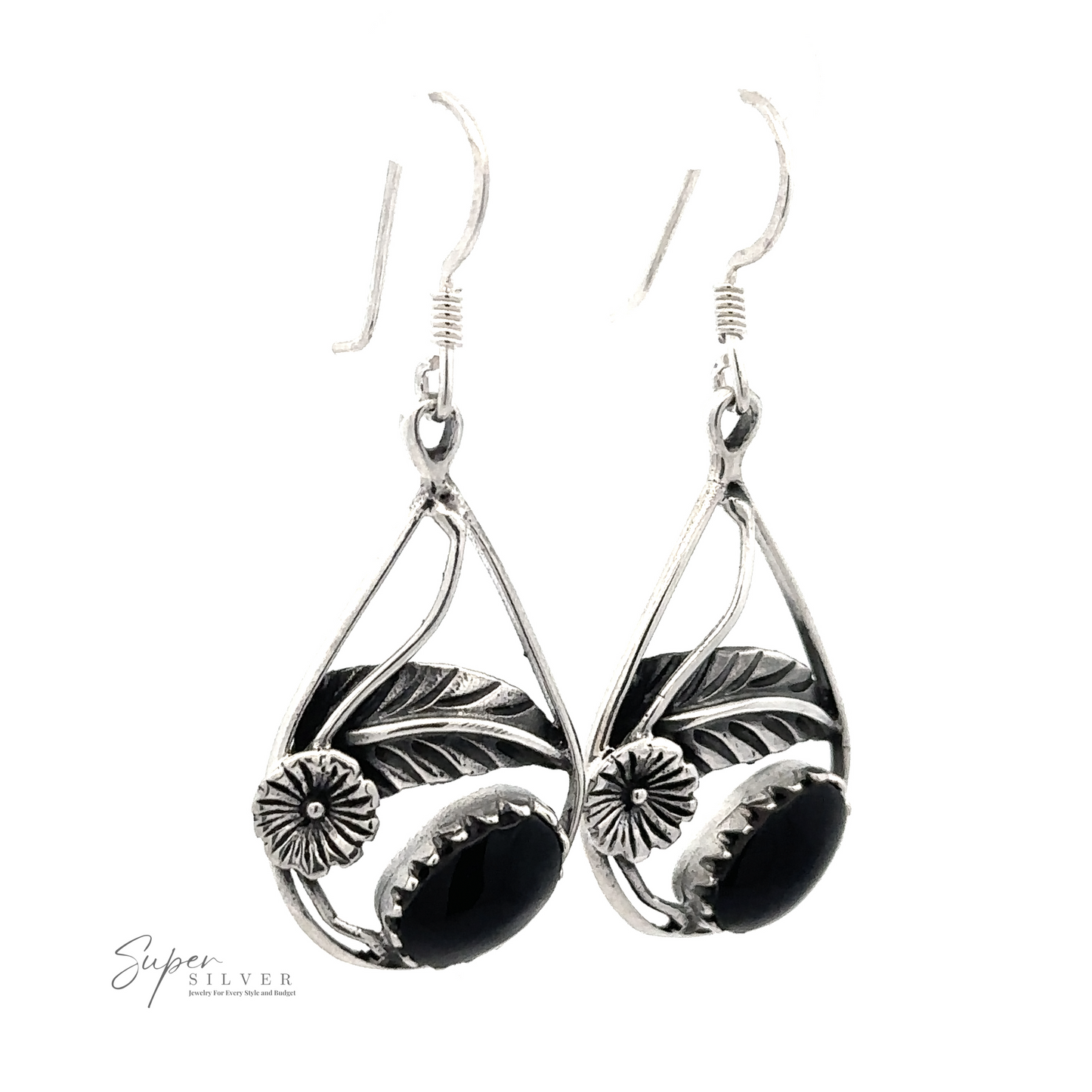 
                  
                    Pair of Inlaid Teardrop Earrings With Floral Setting with black stones and a floral leaf design.
                  
                