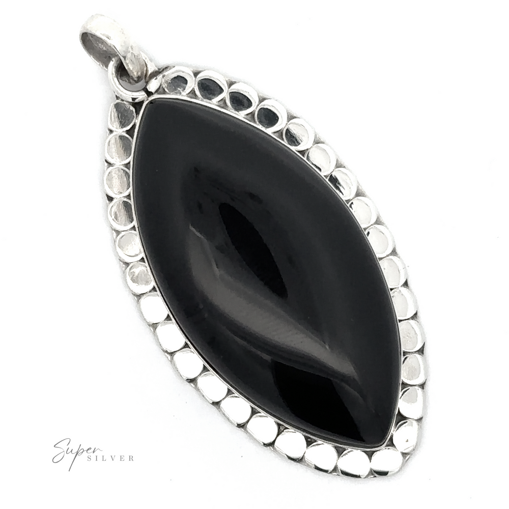 
                  
                    This bold statement piece is an elongated Statement Onyx Pendant With a Textured Setting, labeled "Super Silver.
                  
                