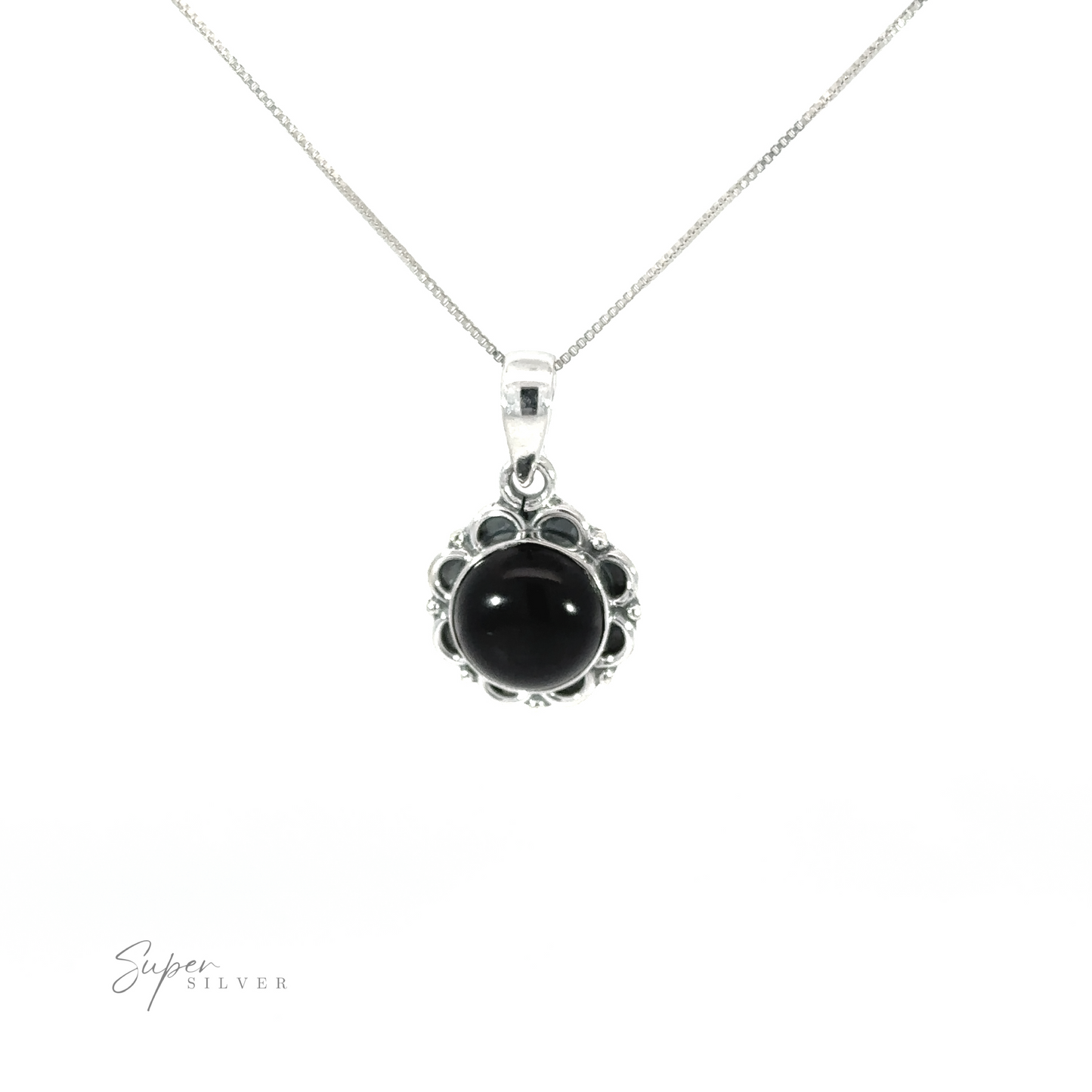 
                  
                    A round gemstone pendant with flower border on a silver chain.
                  
                