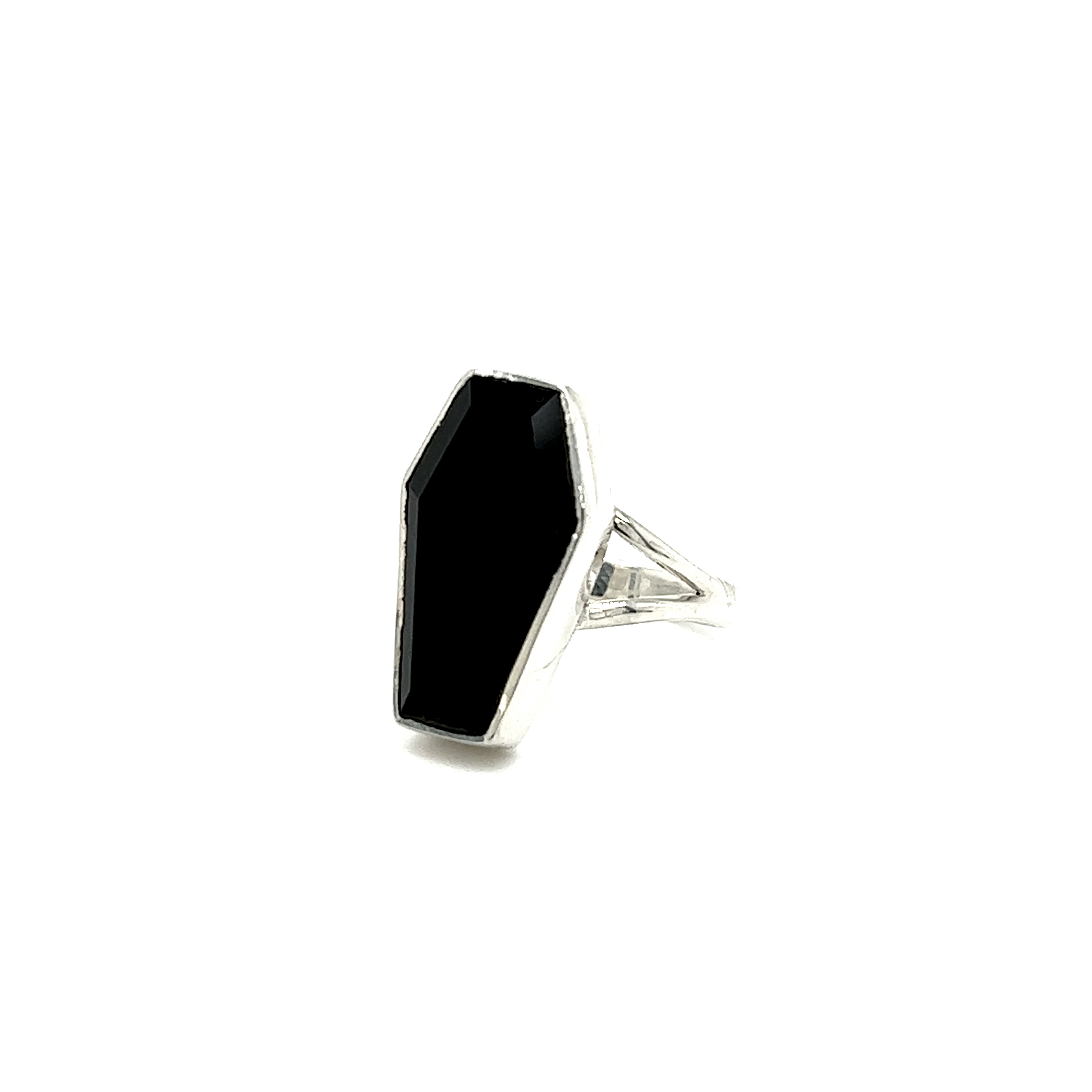 A Super Silver faceted onyx coffin ring resting on a white background.