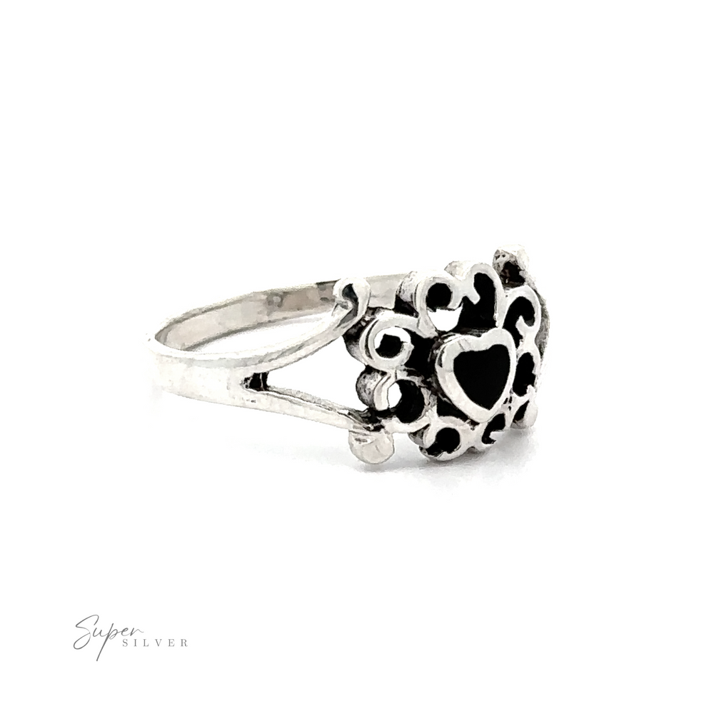 
                  
                    A sterling silver ring with Filigree Design Surround Inlaid Stone Heart designs in a heart shape.
                  
                
