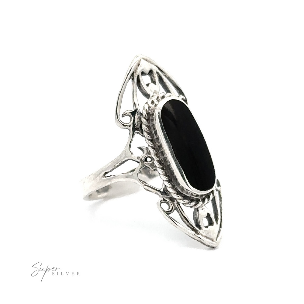 
                  
                    Elongated Filigree Ring With Oval Inlaid Stone with an intricate open filigree metalwork and elongated black gemstone.
                  
                