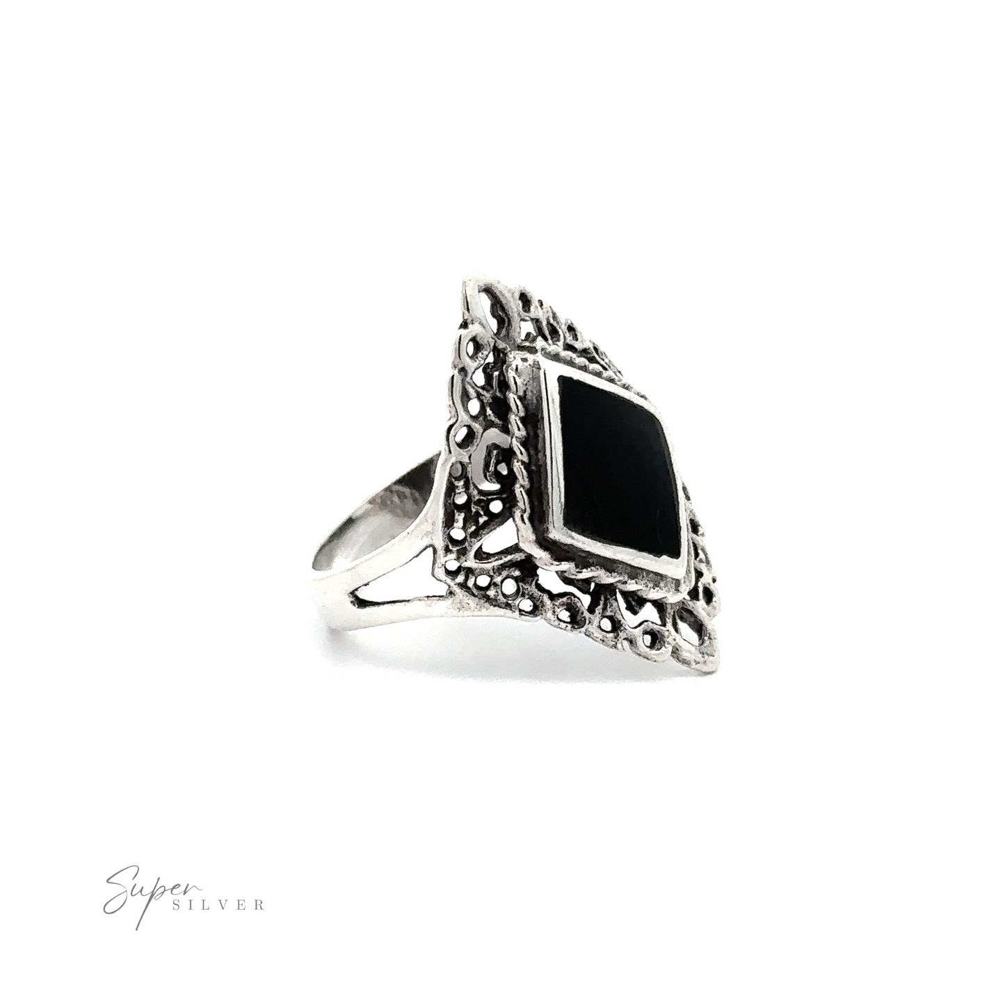 
                  
                    A diamond shaped filigree ring with inlaid stones.
                  
                