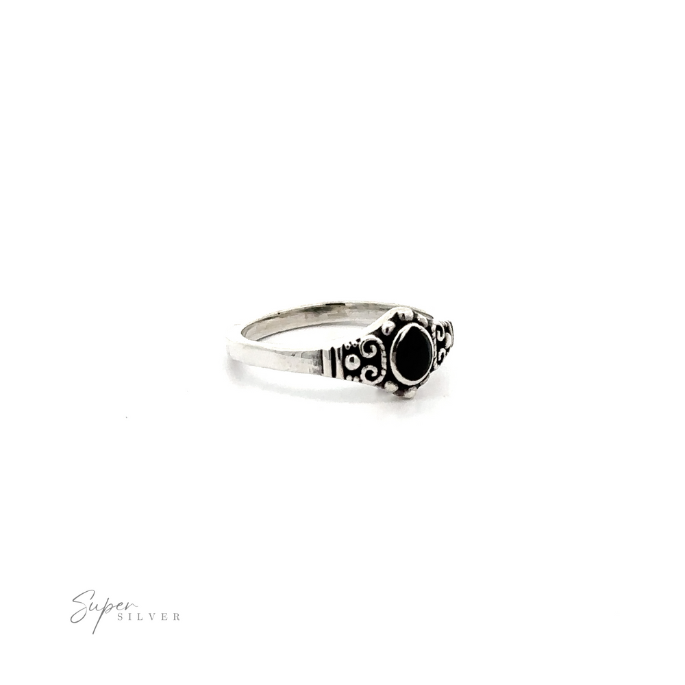 
                  
                    A vintage Dainty Inlaid Stone Ring With Silver Beads and Swirls, exuding bohemian charm.
                  
                