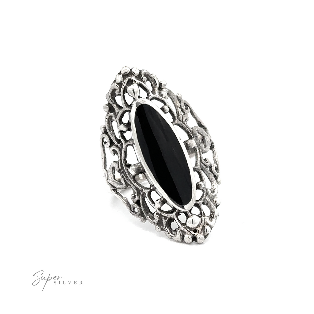
                  
                    An ornate Filigree Shield Ring with Inlaid Stones and inlaid black onyx stone.
                  
                