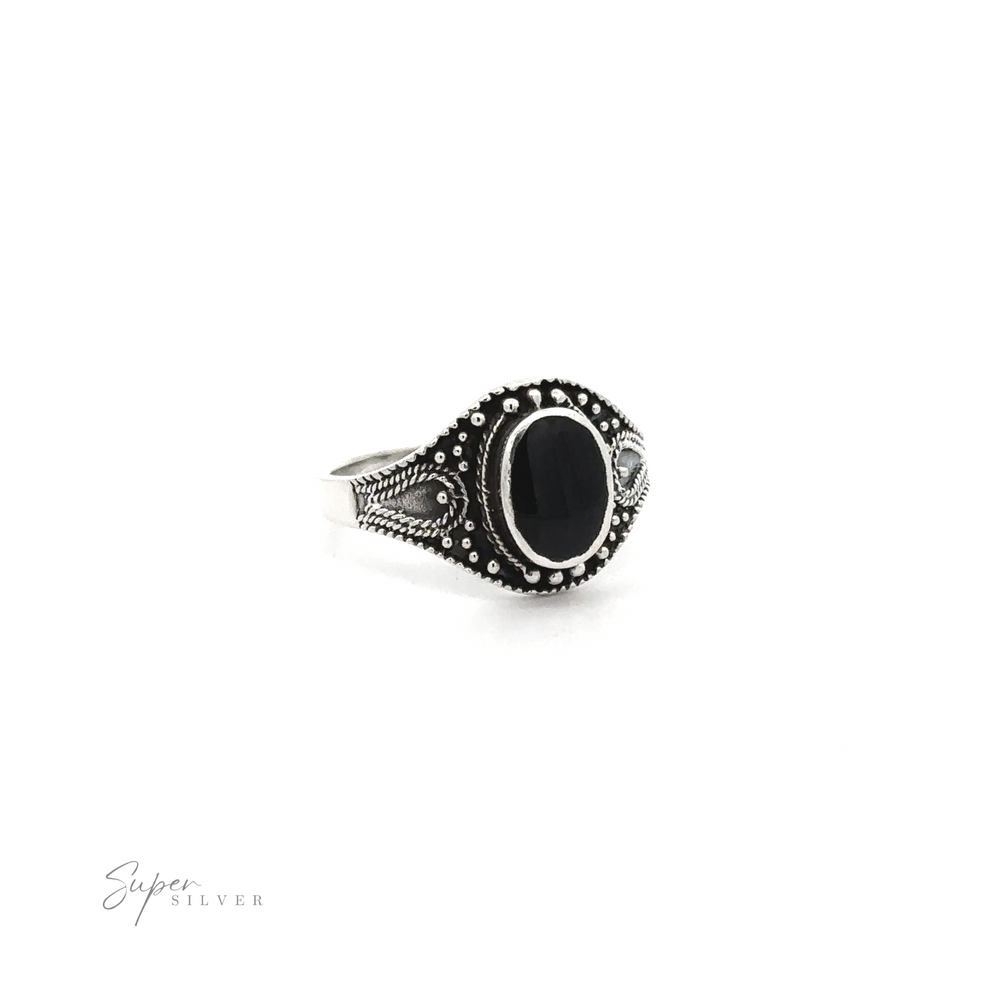 
                  
                    A vintage-chic Vintage Style Oval Shield Ring with Inlaid Stones, featuring oxidized detailing to spruce it up.
                  
                
