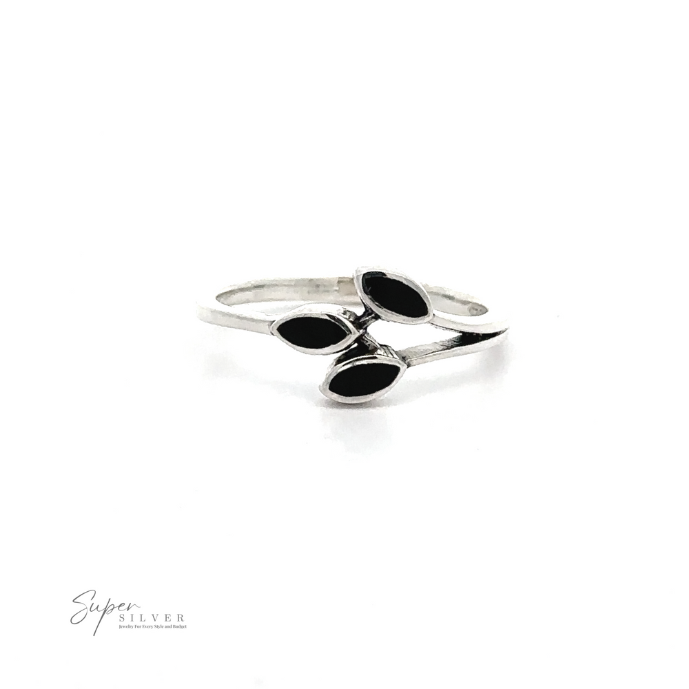 
                  
                    A sterling silver ring featuring three black, leaf-shaped gemstones arranged in a cluster, this minimalist Tiny Leaves Ring with Inlaid Stones is perfect for adding a touch of elegance to any outfit.
                  
                