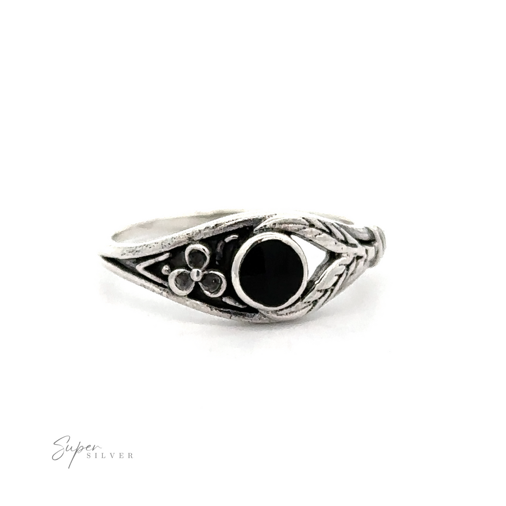 
                  
                    A Inlay Stone Ring with Flower and Leaf Design with a black onyx stone.
                  
                