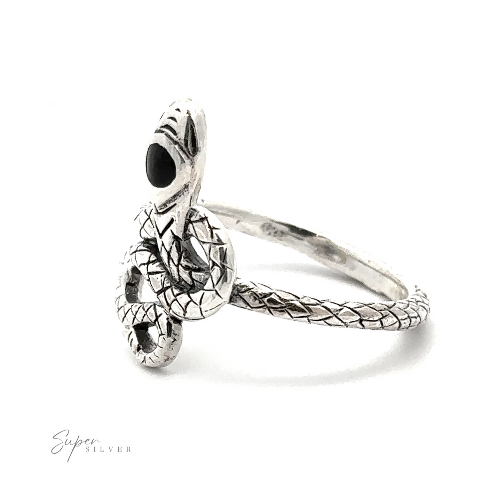 
                  
                    The Coiled Snake Ring with Inlaid Stone is a sterling silver ring designed with an intricate snake motif, featuring detailed scales and a black gemstone as the snake’s eye.
                  
                