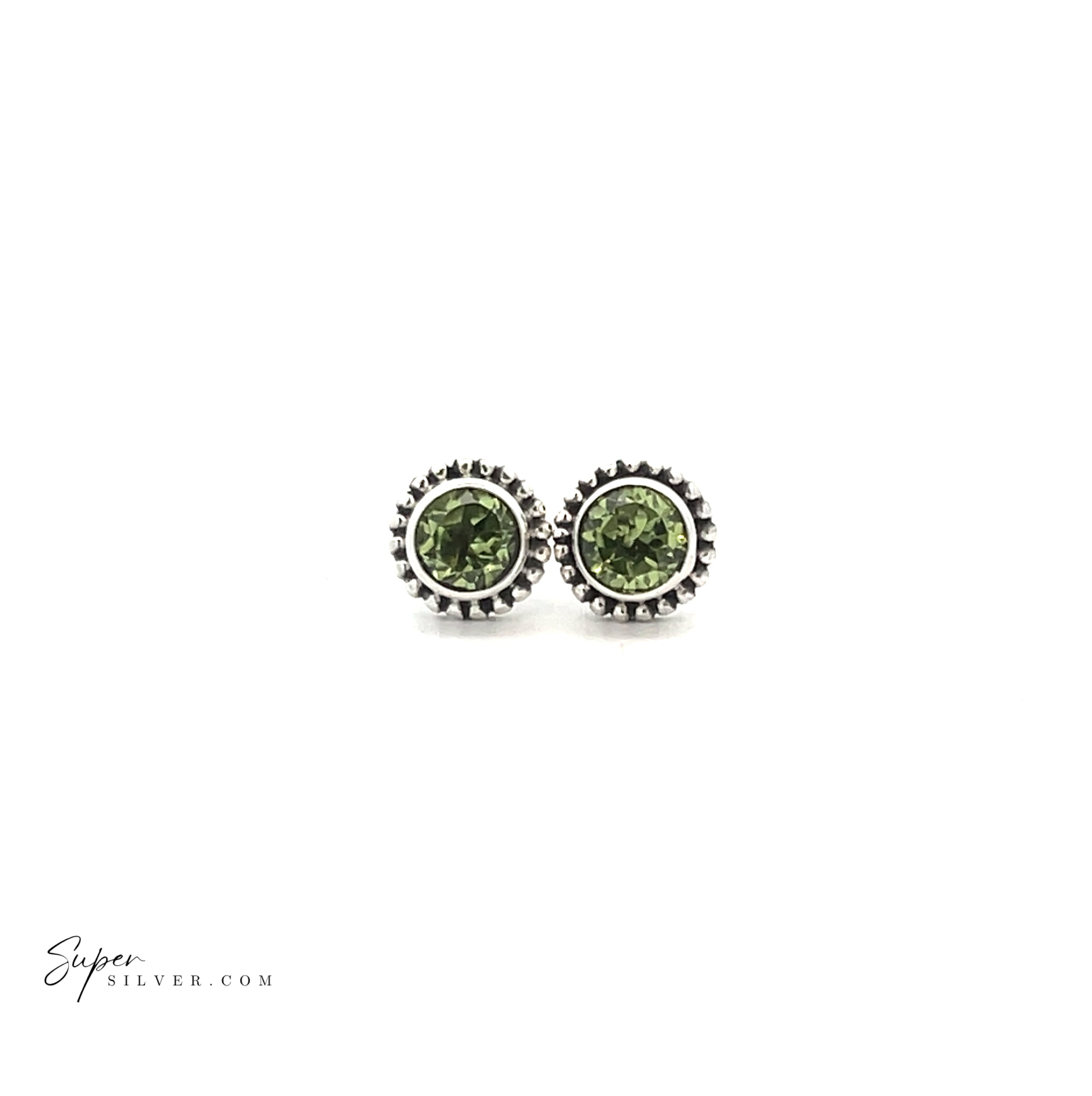 The Beaded Round Faceted Gemstone Studs are sterling silver earrings featuring green gemstones and a beaded border, shown on a plain white background.