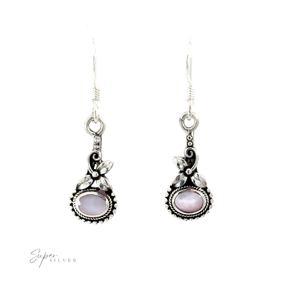 
                  
                    A pair of Inlaid Flower Earrings with Oval Stone, featuring purple gemstones set in ornate silver settings, adorned with leaf accents and intricate detailing exuding vintage charm. "Super Silver" text is in the bottom left corner.
                  
                