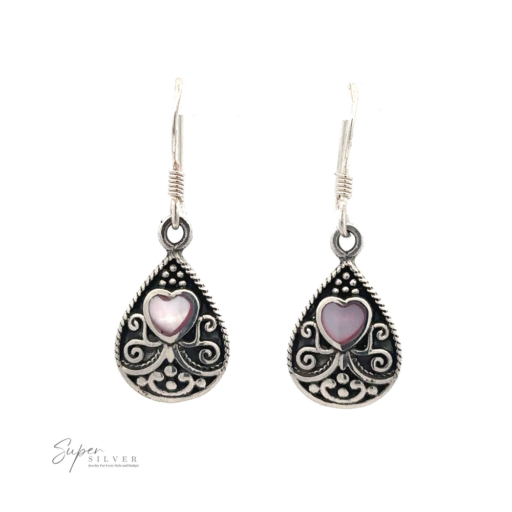 
                  
                    Bali Style Teardrop Earrings with Inlaid Stone with intricate sterling silver details and a purple heart design in the center, displayed on a white background.
                  
                