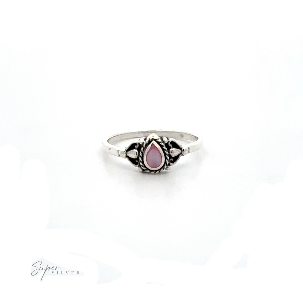
                  
                    A Delicate Teardrop Inlay Stone Ring with Vintage Look with a pink stone.
                  
                
