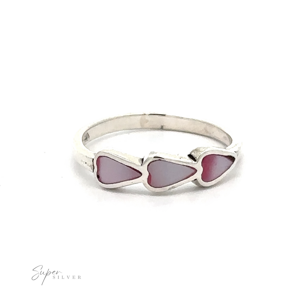 
                  
                    A Triple Heart Ring with Inlaid Stones in sterling silver with three heart-shaped pink stones.
                  
                