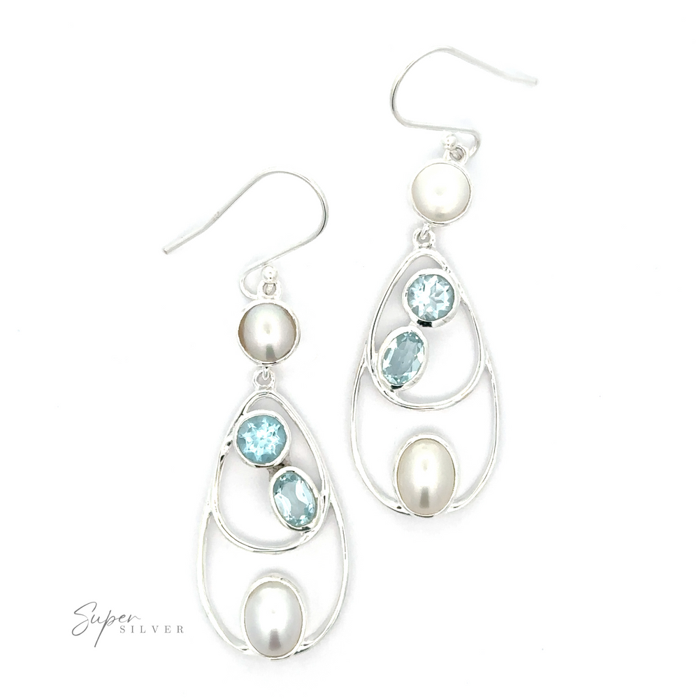 Introducing our Stunning Teardrop Pearl and Blue Topaz Earrings. These teardrop pearl earrings showcase two white pearls and two blue topaz gemstones in each piece, exuding elegance. They feature a hooked closure and proudly display the 