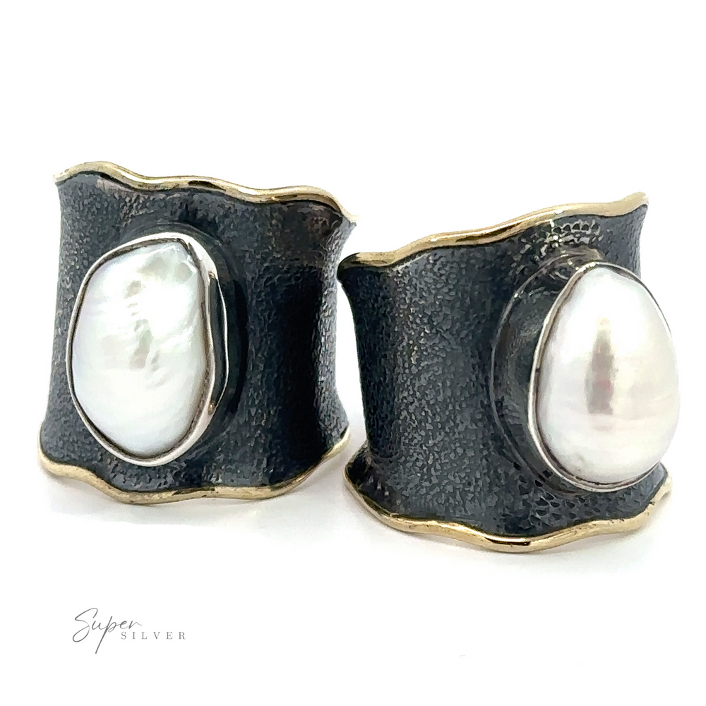 A pair of Oxidized Cigar Band with Gold Trim and Pearl earrings on a white background.