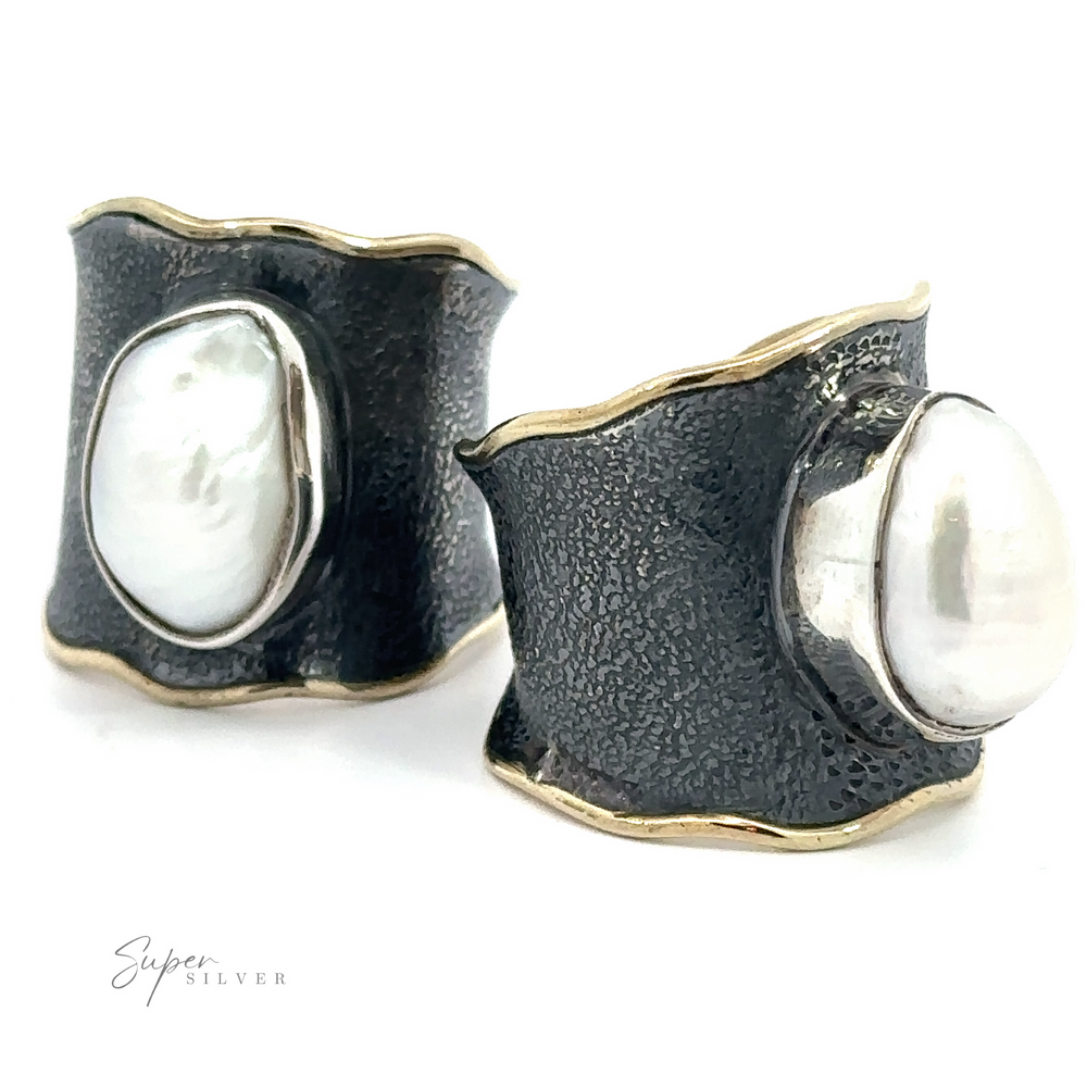A pair of Oxidized Cigar Band earrings with a Gold Trim and Pearl.