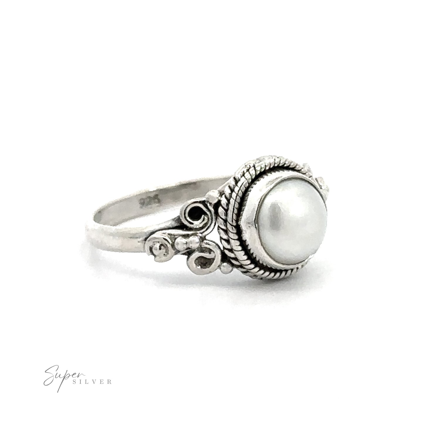 
                  
                    A vintage boho Natural Oval Gemstone Ring with intricate metalwork on a white background.
                  
                