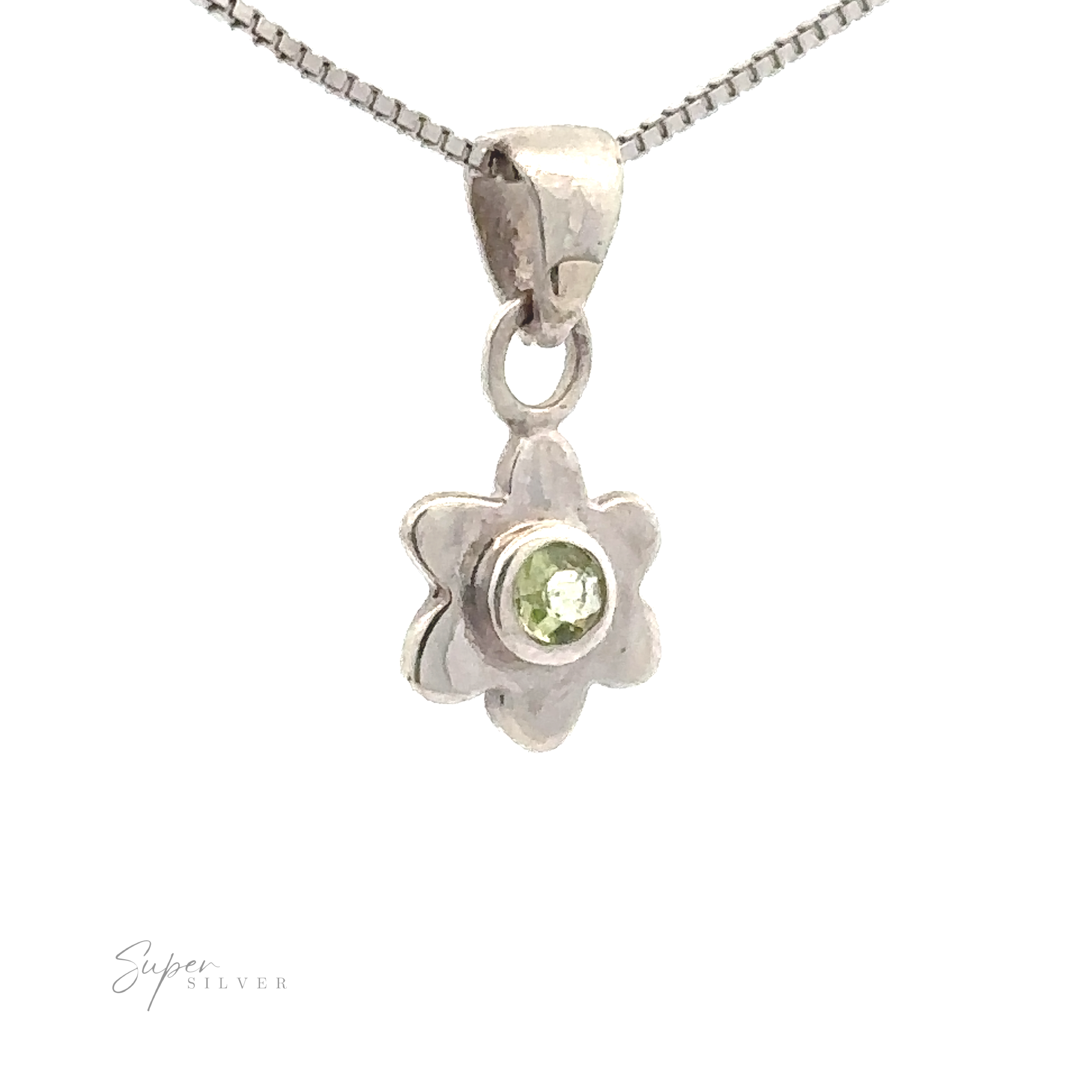 A sterling silver jewelry piece, this delicate Tiny Gemstone Flower Pendant features a small green gemstone at its center, artfully displayed against a white background.