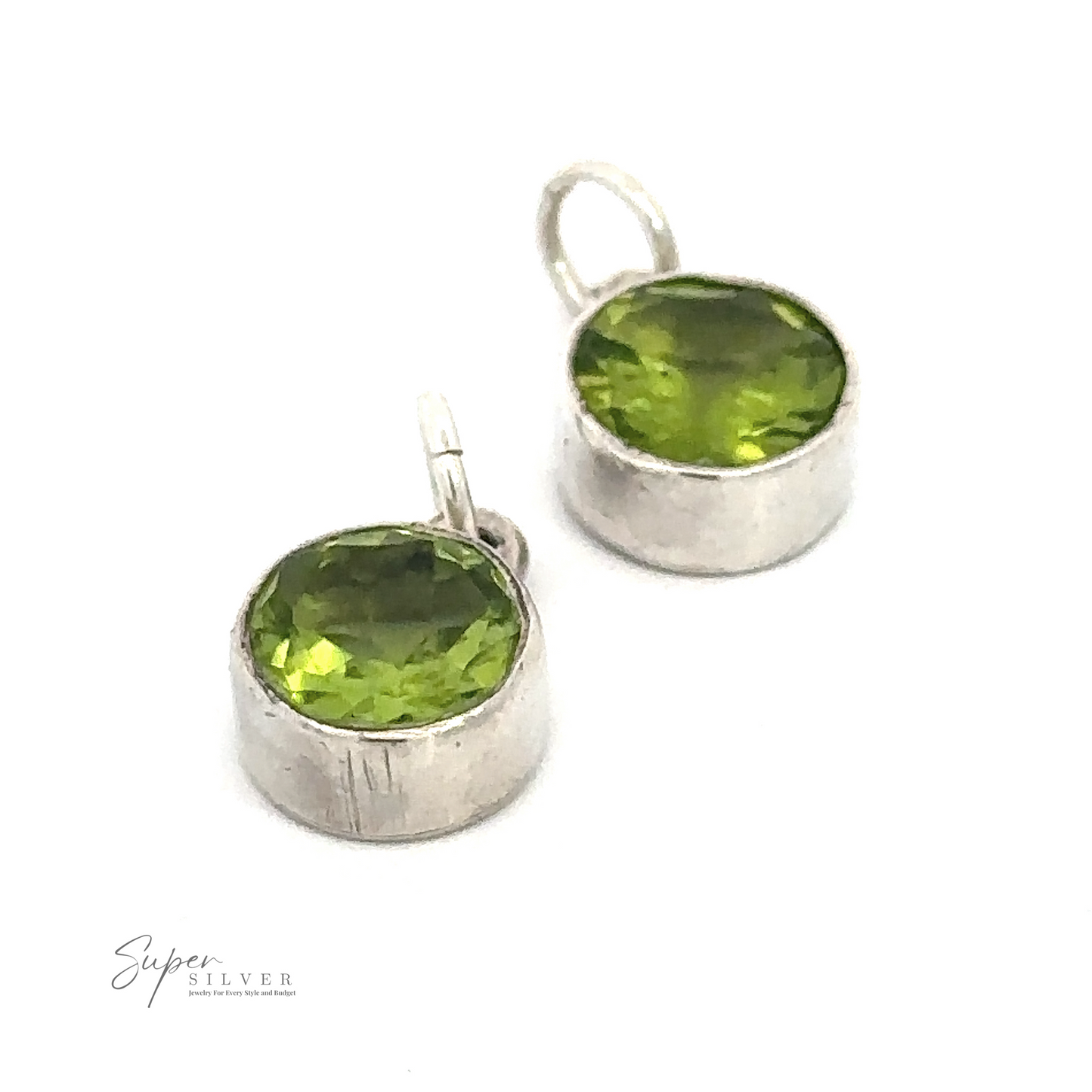 
                  
                    A Round Peridot Pendant, the birthstone for August, set in .925 Sterling Silver bezels, displayed on a white background. The pendant settings have loops for attaching to a chain.
                  
                