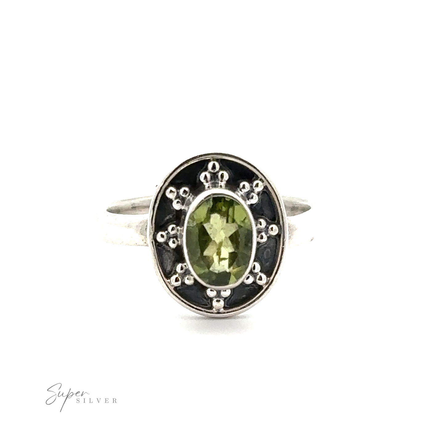 
                  
                    An Oval Gemstone Ring with Ball and Disk Border, with a central green gemstone surrounded by decorative metal details, exudes a vintage-inspired elegance. The brand name "Super Silver" is visible in the lower left corner.
                  
                